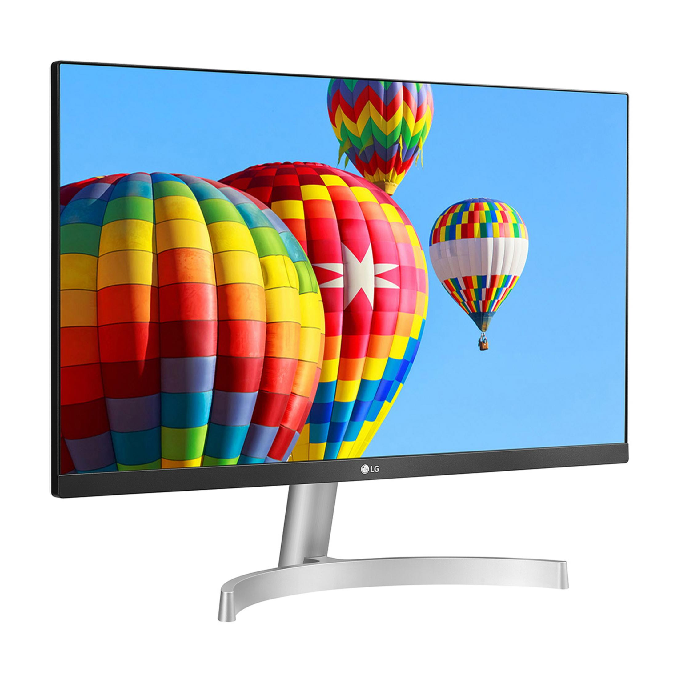 Un monitor LG mostra mongolfiere colorate su cielo blu.