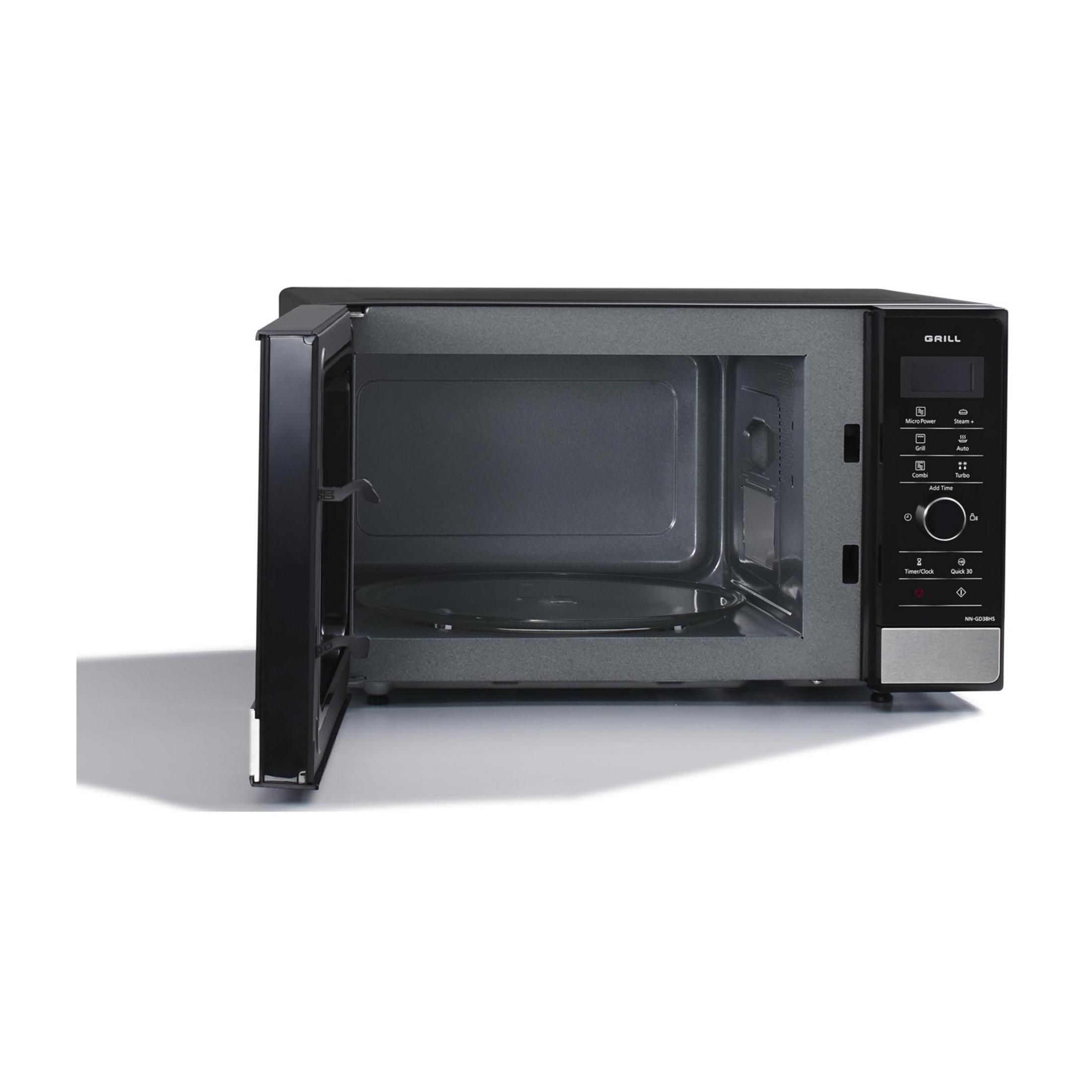 Czarna kuchenka mikrofalowa z otwartymi drzwiami, szklanym talerzem obrotowym i panelem sterowania.