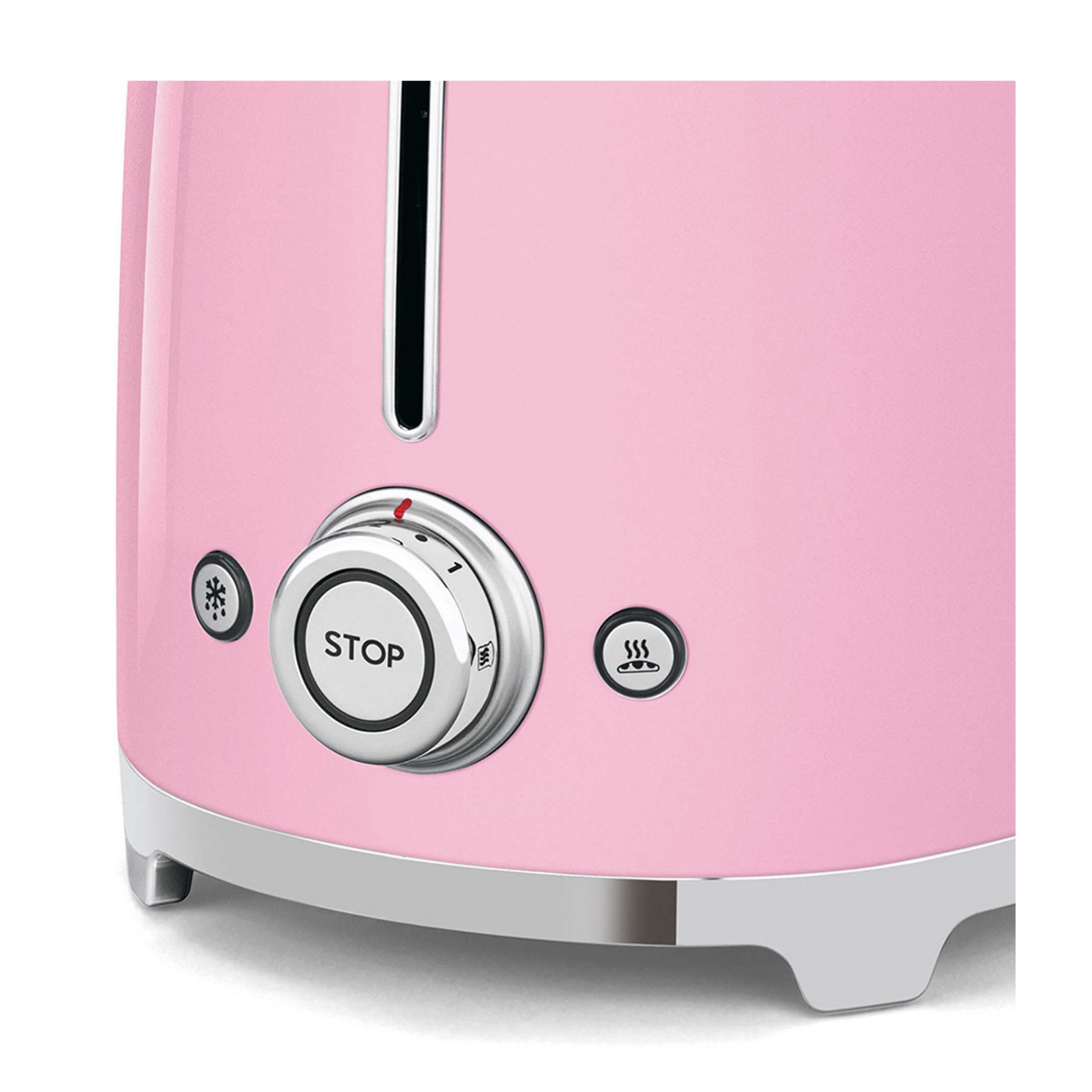 Ein rosafarbener Toaster mit silbernen Bedienelementen, darunter ein Drehknopf mit der Aufschrift „STOP“.