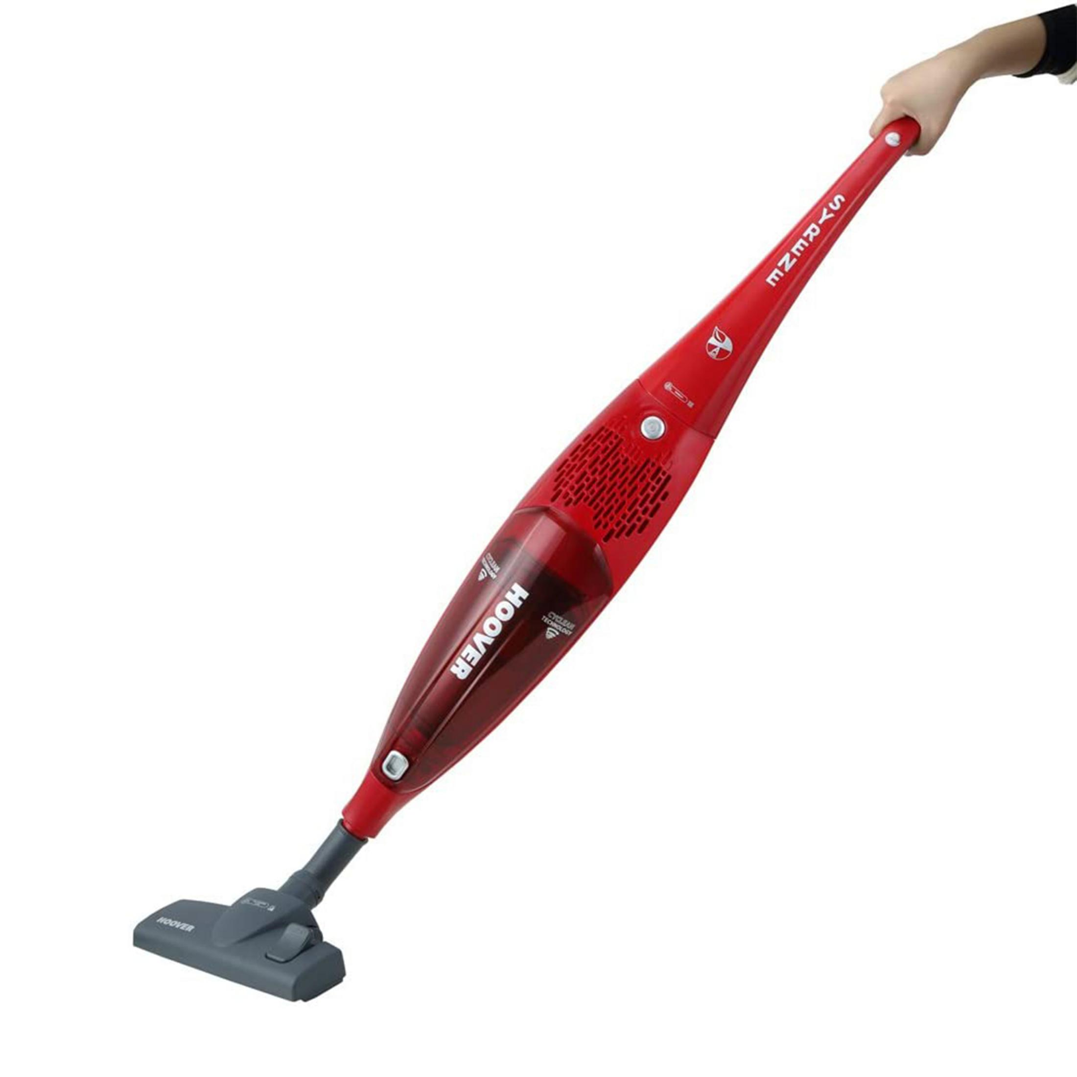 Un aspirapolvere portatile Hoover rosso con testa grigia è tenuto da una mano.