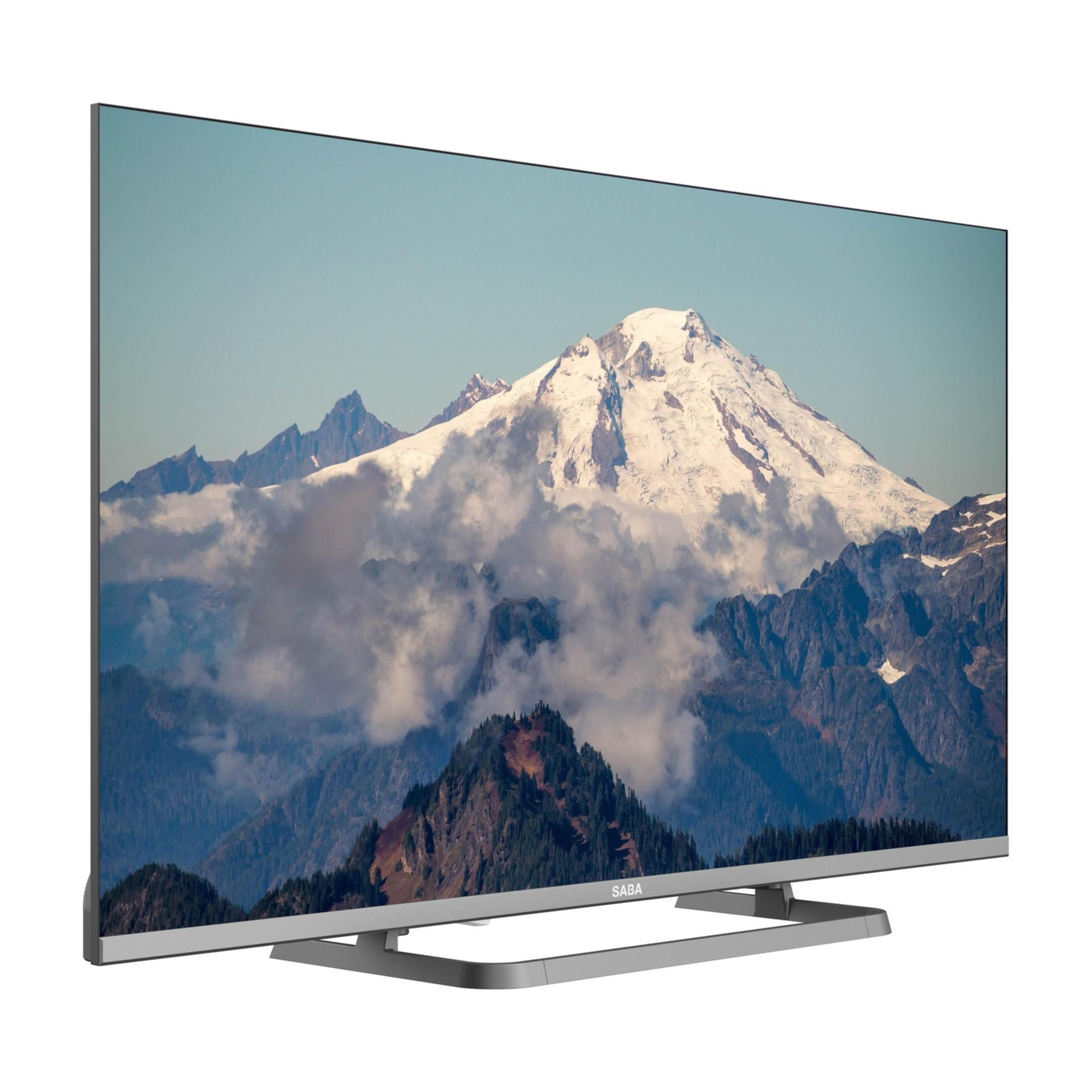 Una TV moderna mostra un panorama montano con neve e nuvole.