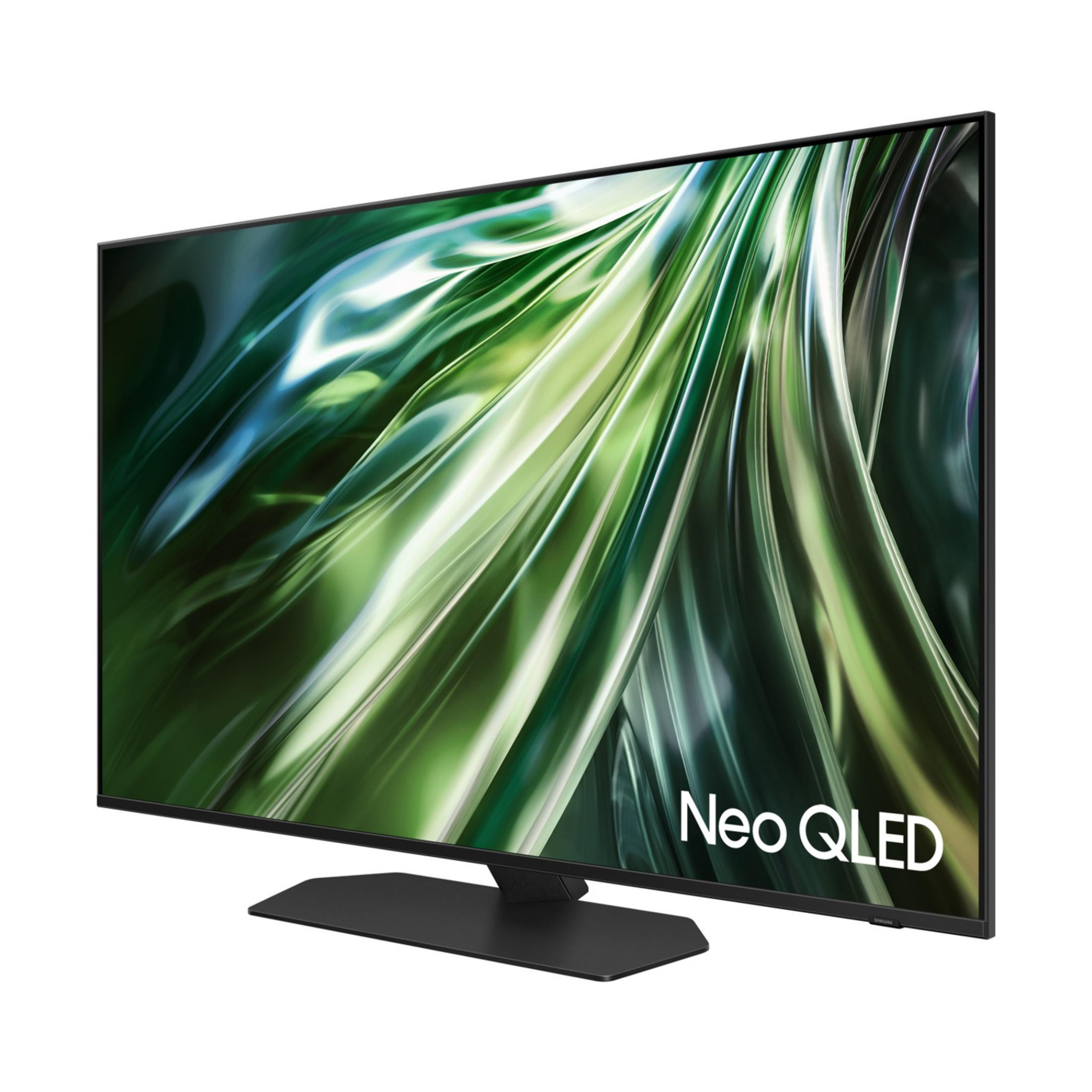 Una TV moderna con supporto nero, che mostra uno sfondo astratto verde.