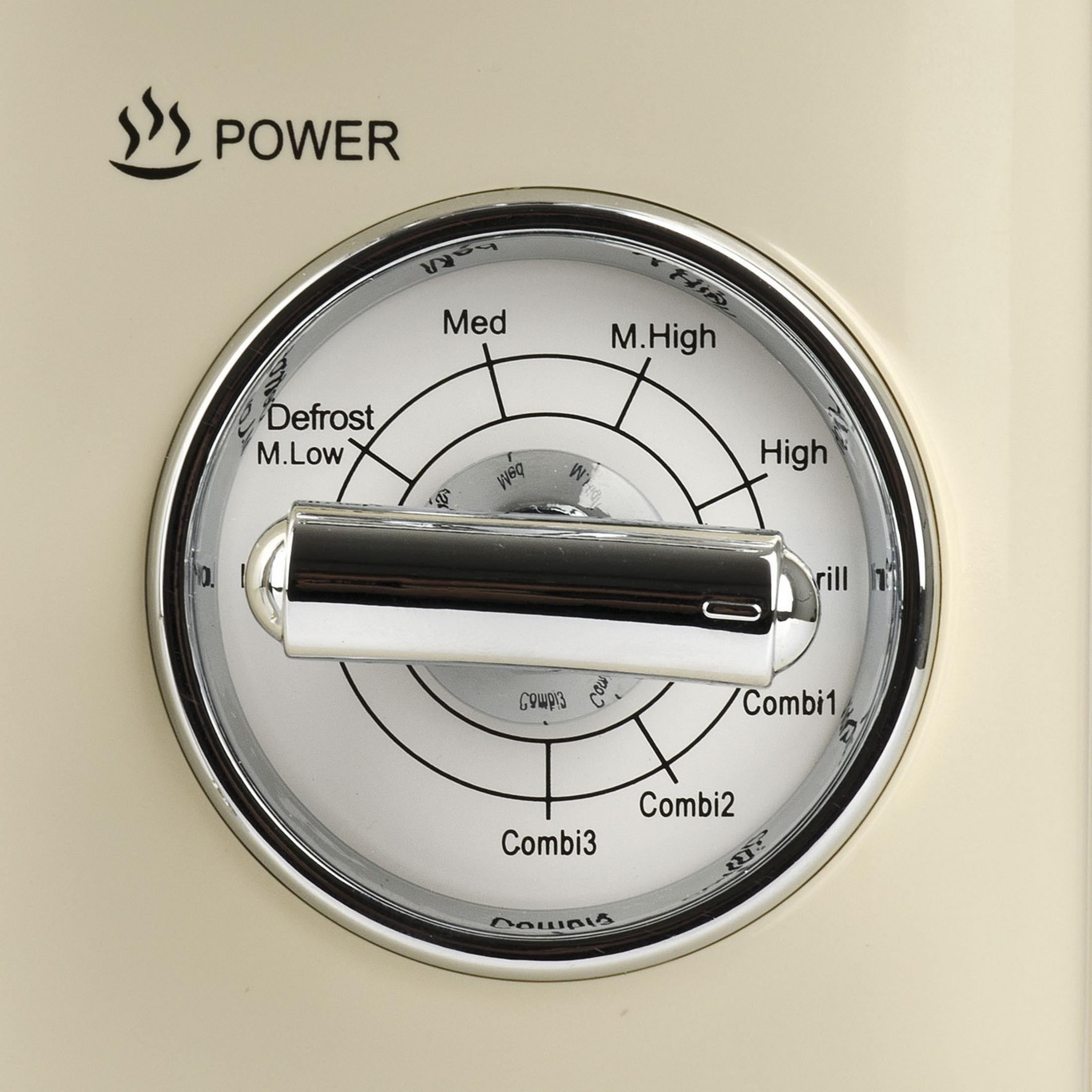 Kremowy panel sterowania z pokrętłem funkcji mikrofalowych.