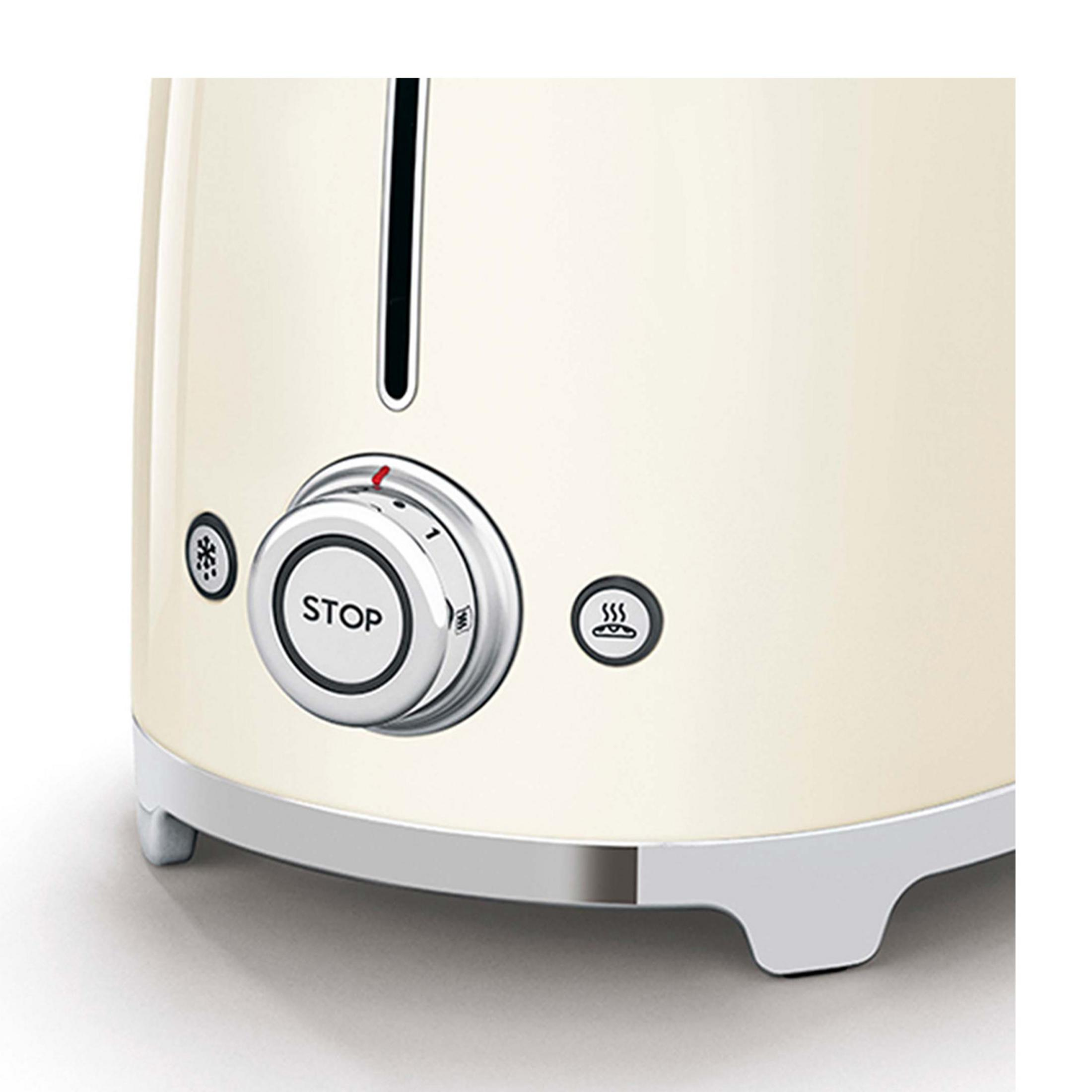 Nahaufnahme eines cremefarbenen Toasters mit silbernen Bedienelementen und Toast-Symbol.