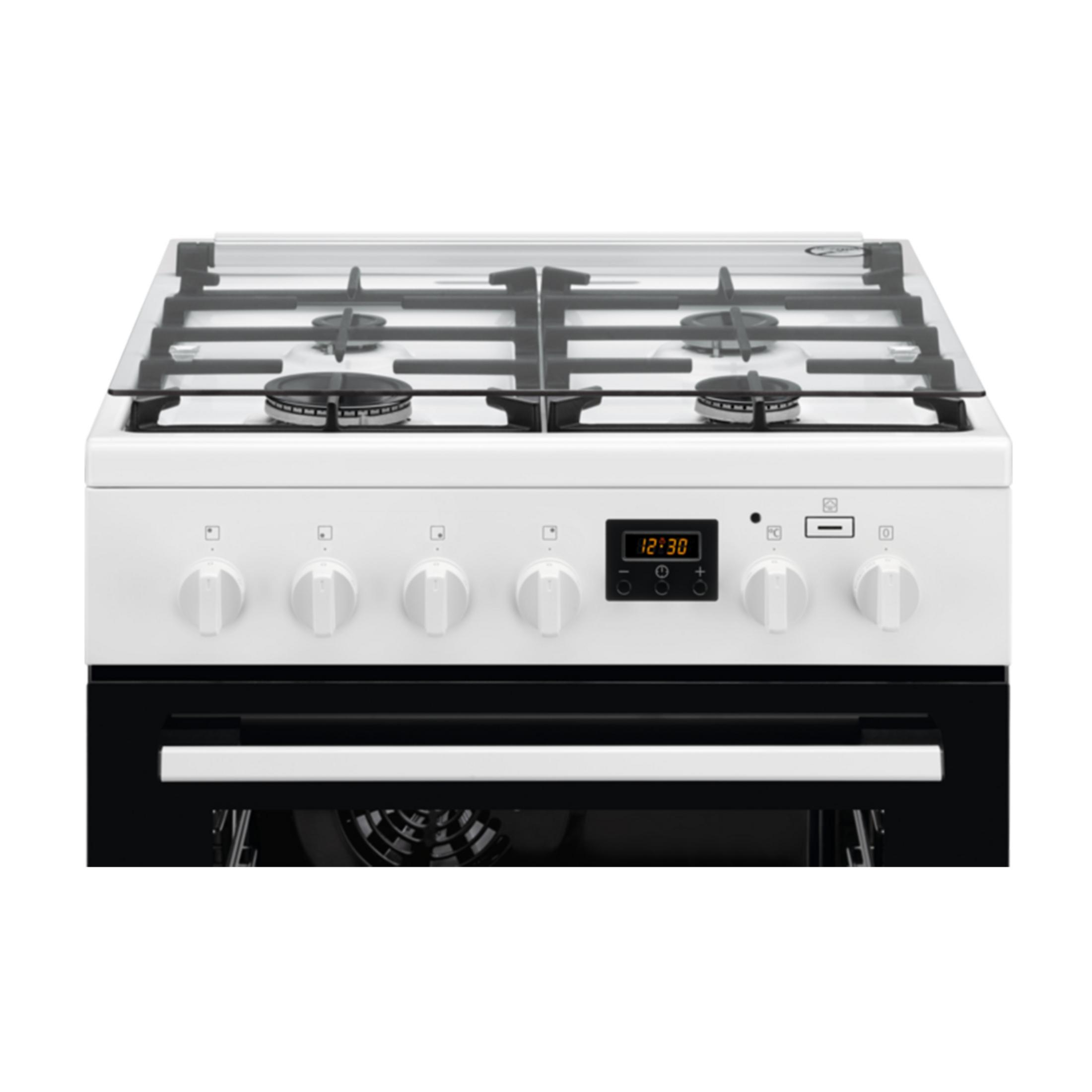 Un fornello a gas bianco con piano in vetro e forno nero sotto.