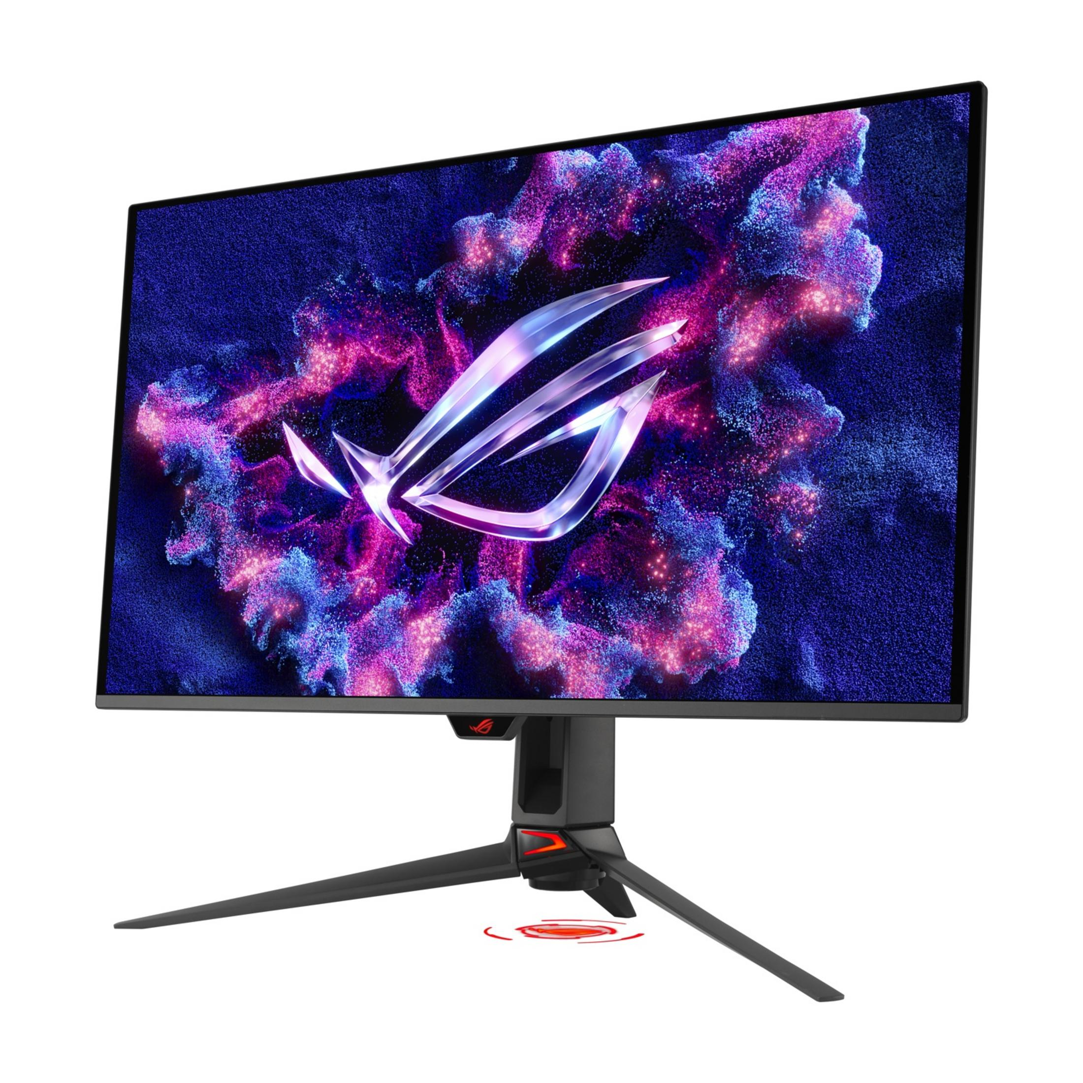 Monitor do gier z stylizowanym logo ROG na tle niebieskich i różowych cząstek.