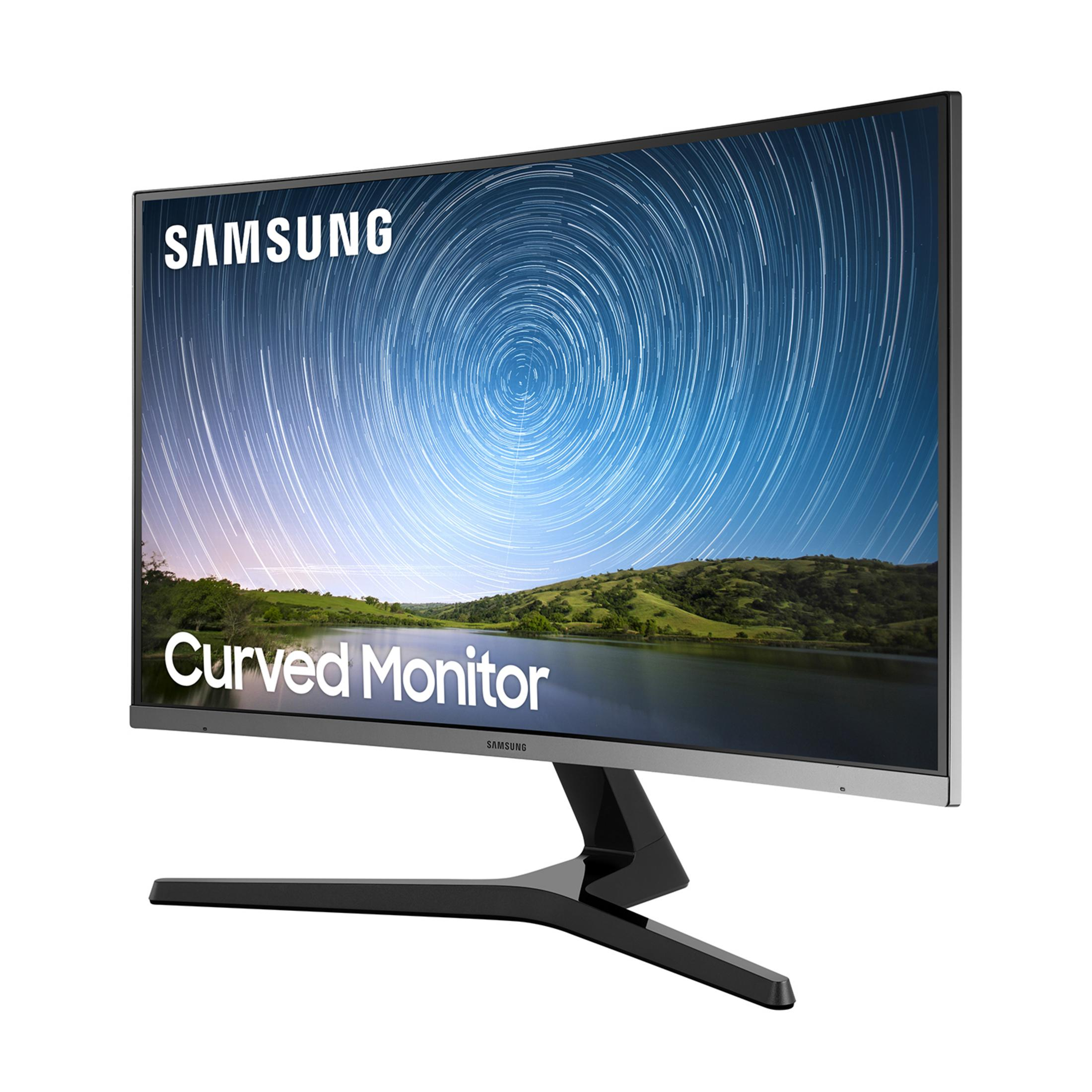 Un monitor curvo Samsung muestra estelas de estrellas sobre un fondo con colinas y agua.