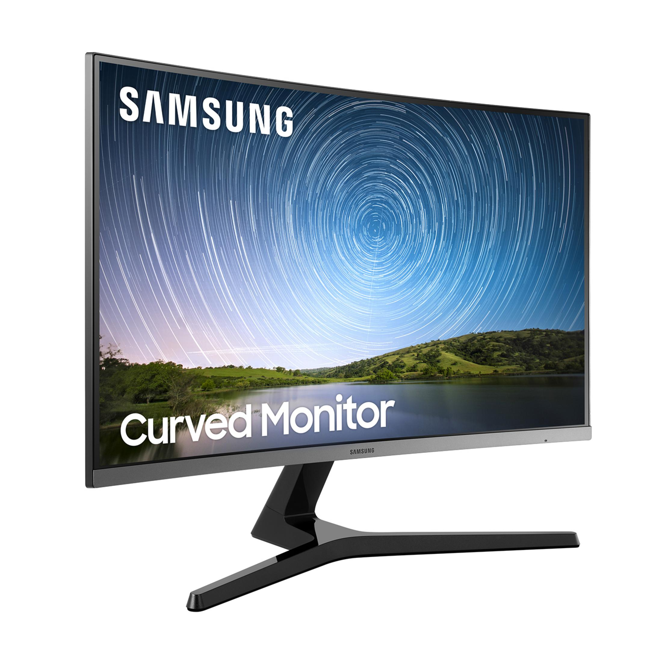 Un monitor curvo Samsung con fondo de estelas de estrellas sobre paisaje.