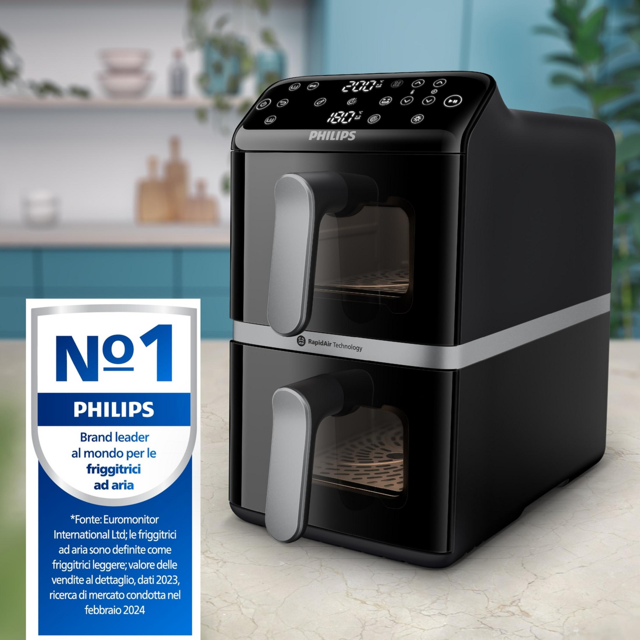 Ein schwarzer Philips Heißluftfritteuse mit zwei Schubladen steht auf einer Marmorarbeitsplatte.