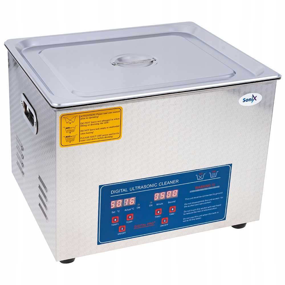 Srebrna myjka ultradźwiękowa z cyfrowym wyświetlaczem i etykietami ostrzegawczymi.