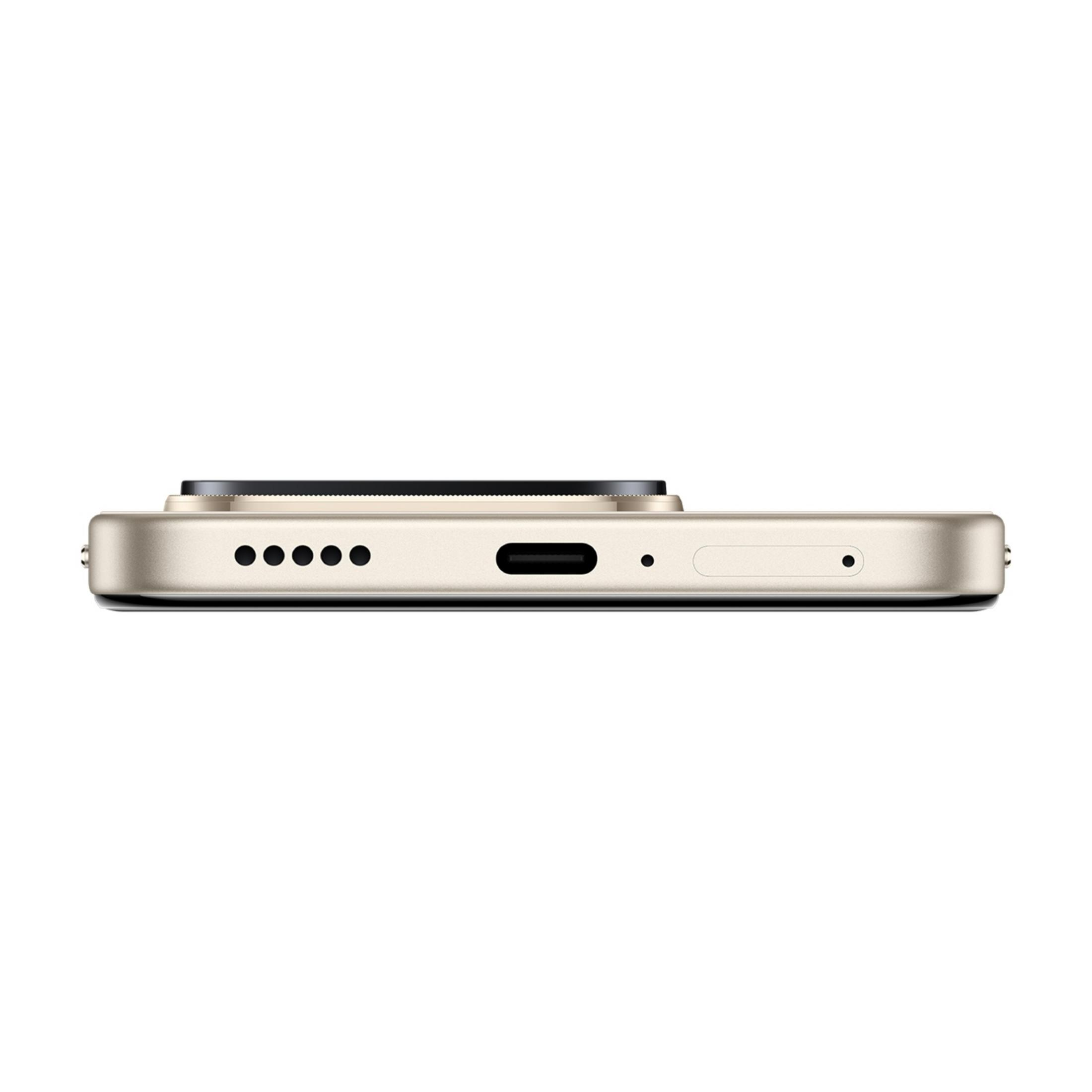 Primer plano de la parte inferior de un smartphone dorado, mostrando el puerto de carga.