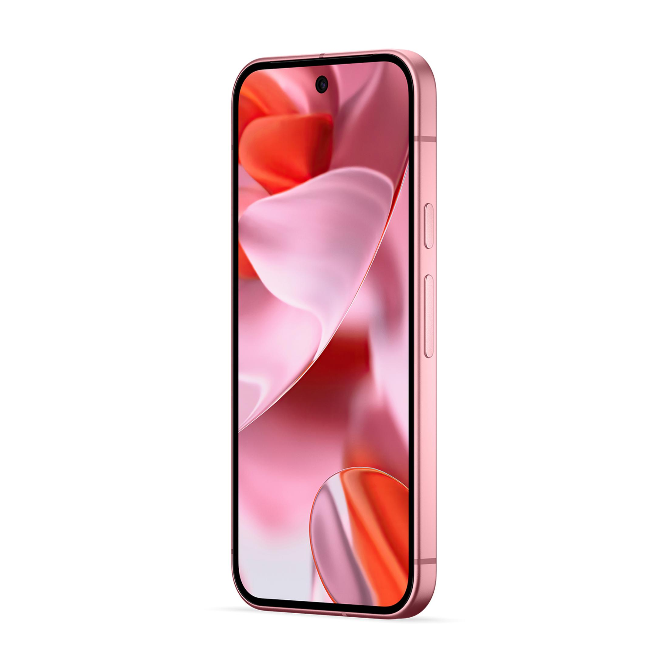 Różowo-złoty smartfon z abstrakcyjną tapetą kwiatową na ekranie.