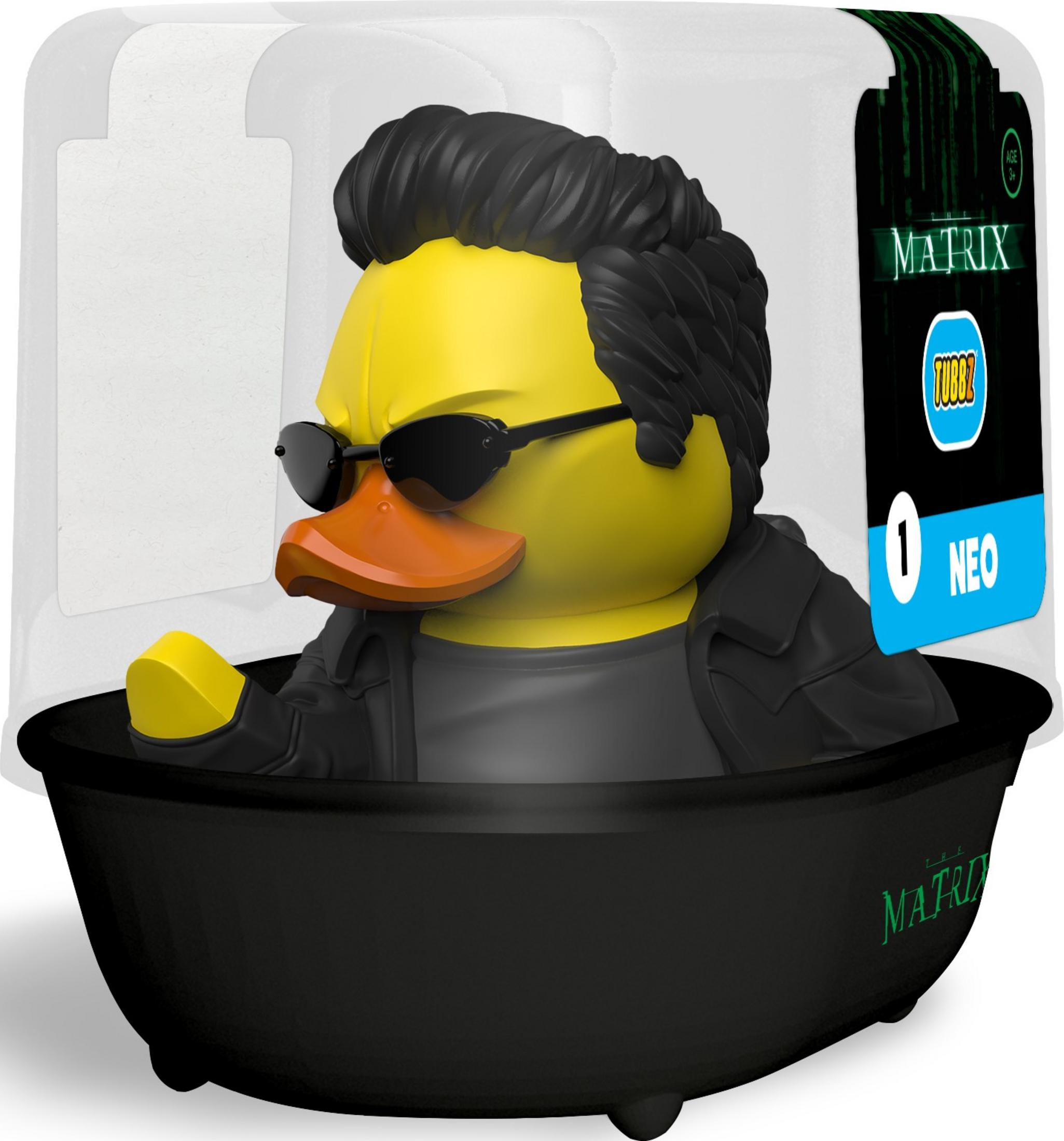 Gelbe "Neo"-Badeente mit schwarzen Haaren und Sonnenbrille in schwarzer Badewanne.