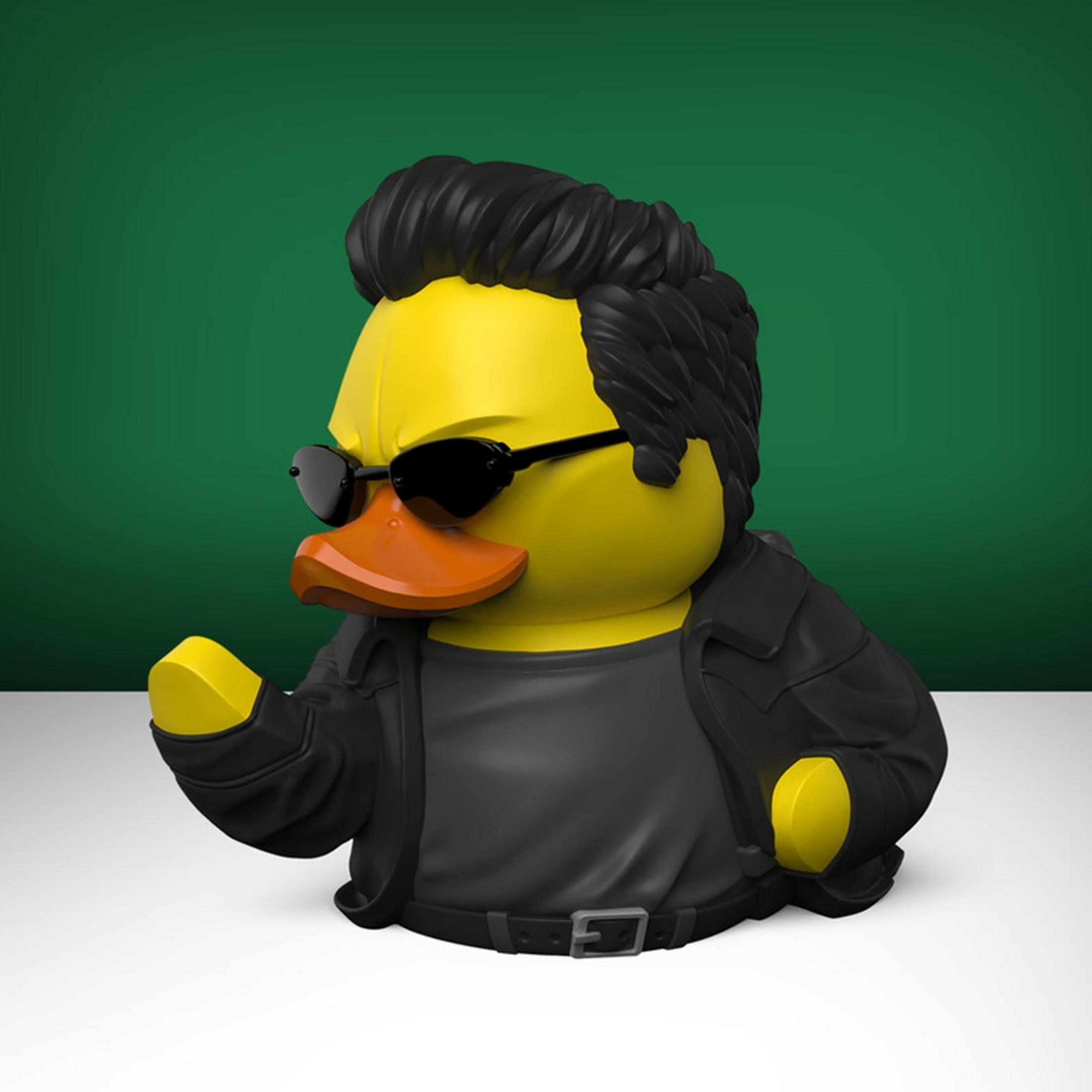 Gelber Gummi-Ente mit schwarzer Lederjacke, Sonnenbrille und toupierter Frisur.