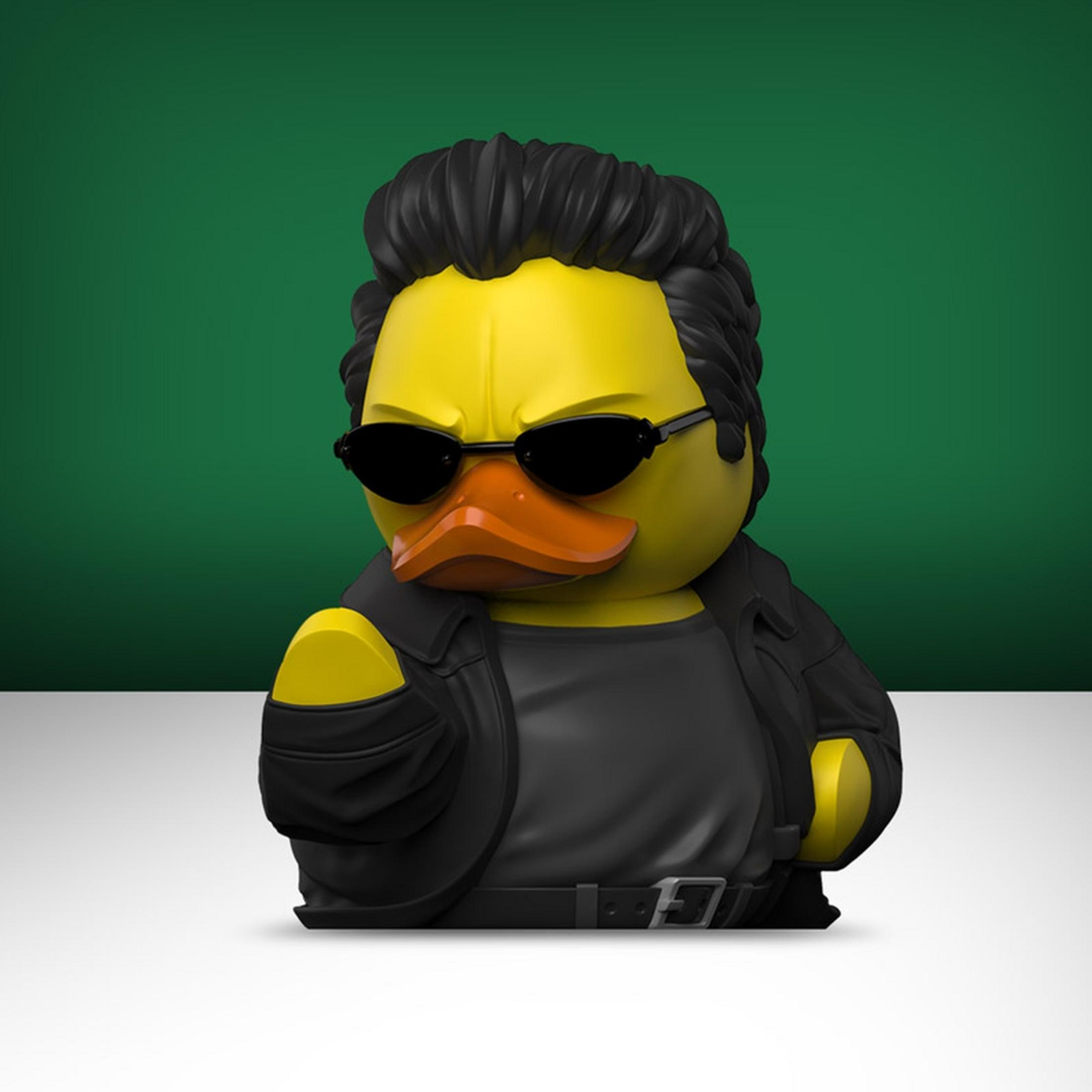 Gelbe Gummiente mit schwarzer Lederjacke, Sonnenbrille und toupierten Haaren.