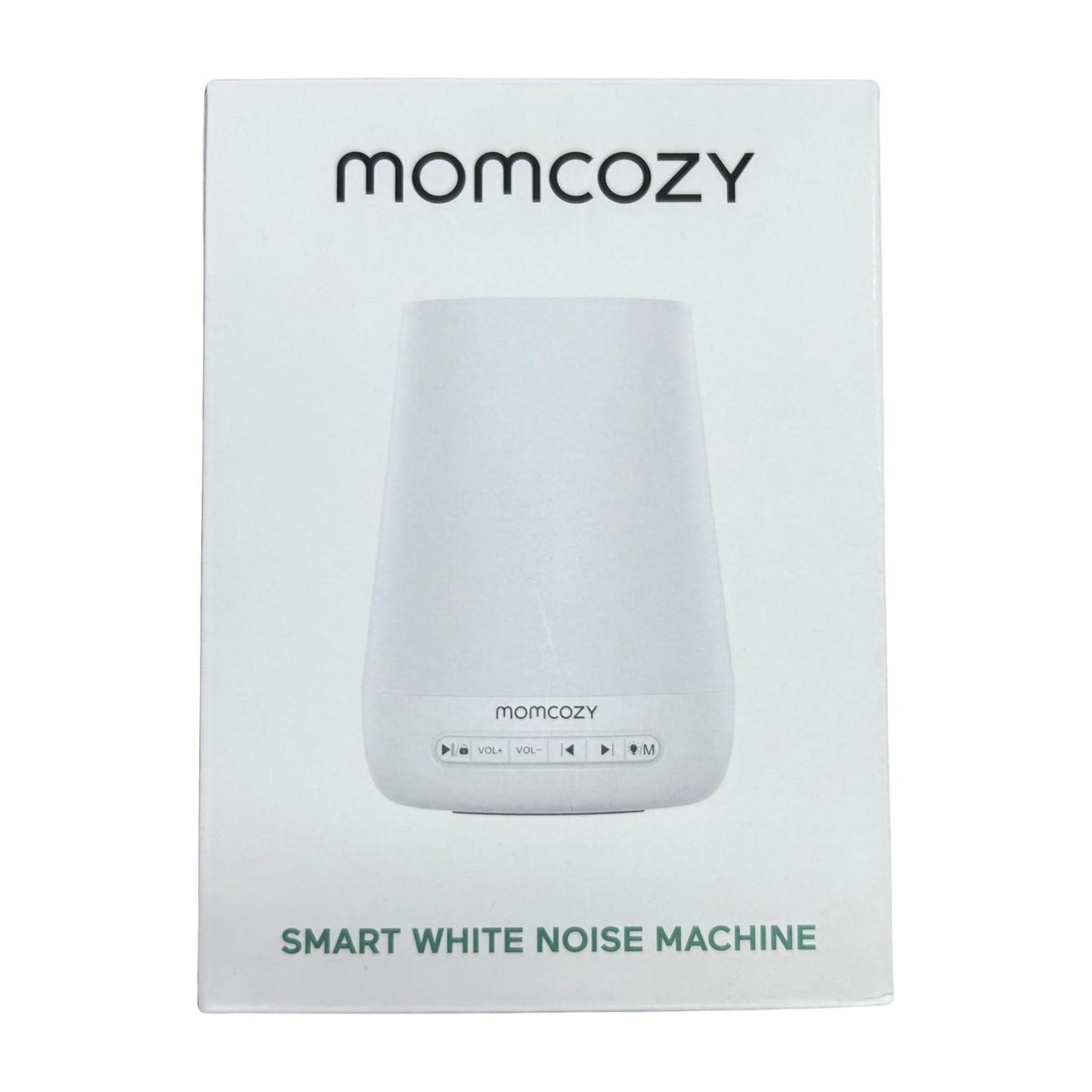 Weiße Momcozy White Noise Machine Verpackung mit Produktbild und Steuerelementen.