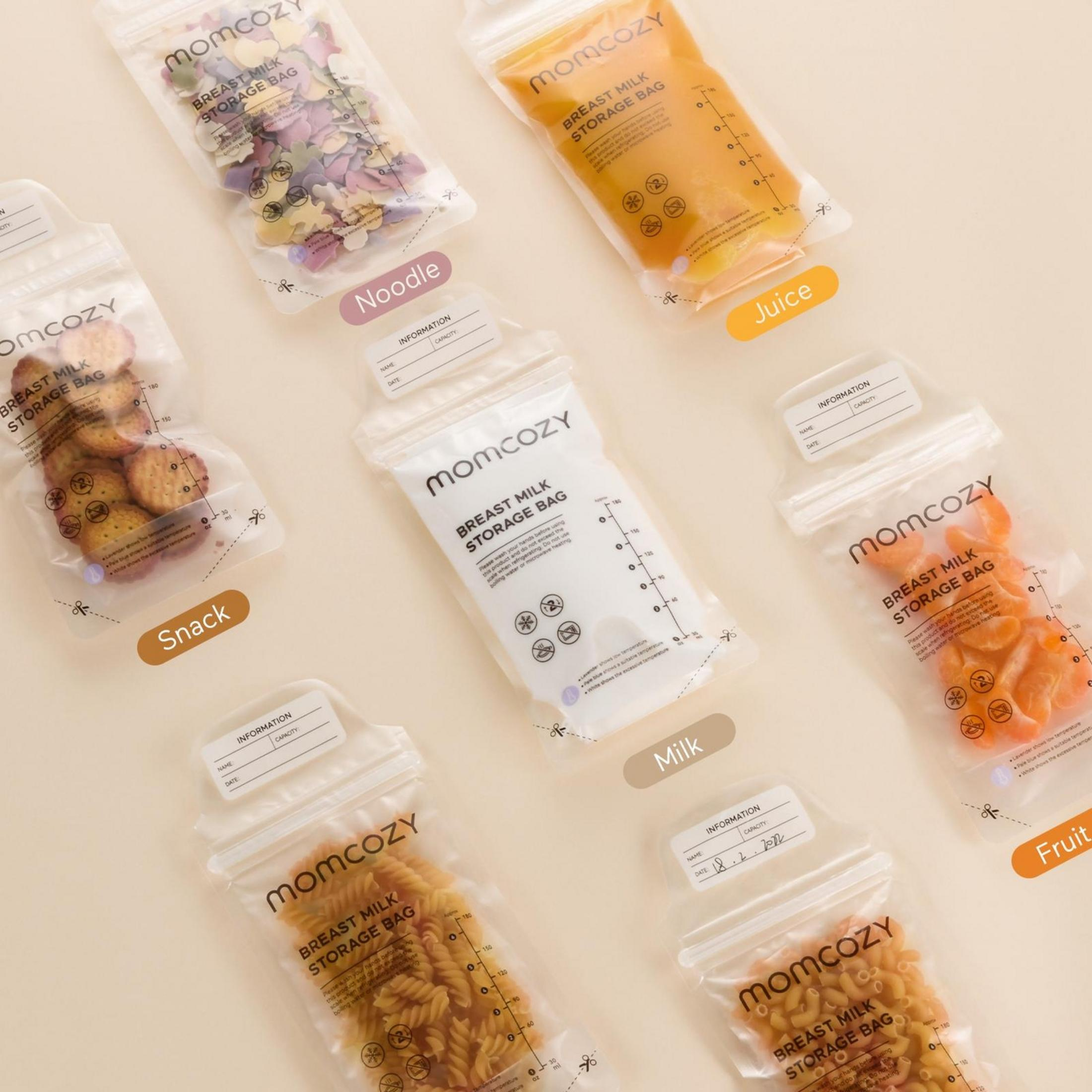 Bunte Perlen in drei Beuteln, Kekse, Mandarinenstücke, Nudeln und Milch.