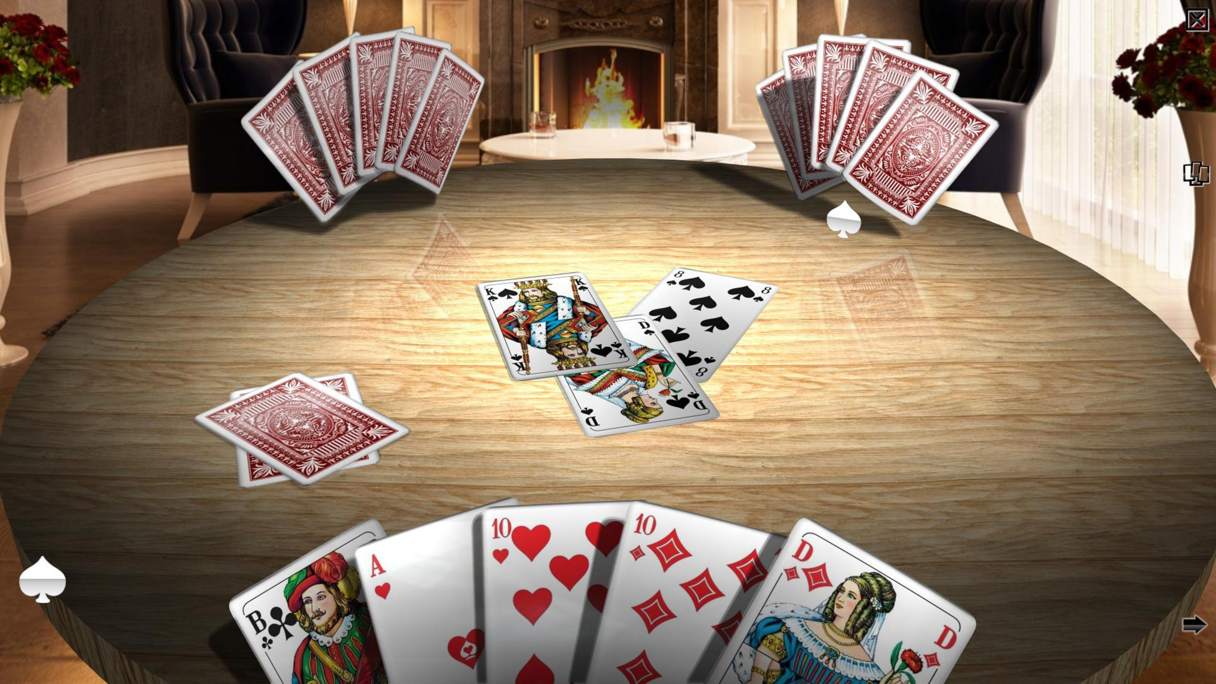Spielkarten liegen auf einem Holztisch mit einem Kamin im Hintergrund.