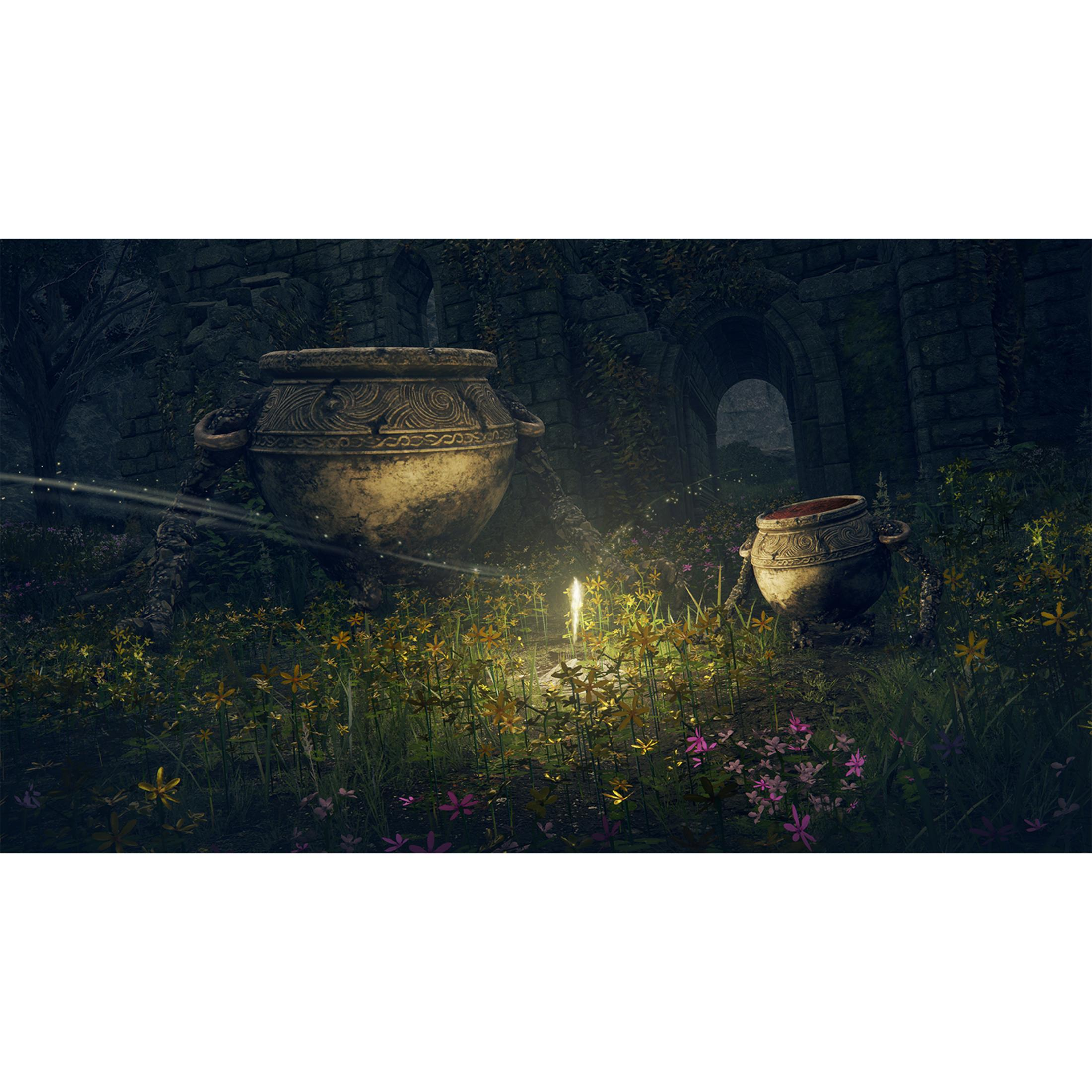Dos ollas gigantes en un bosque florido iluminadas por velas.
