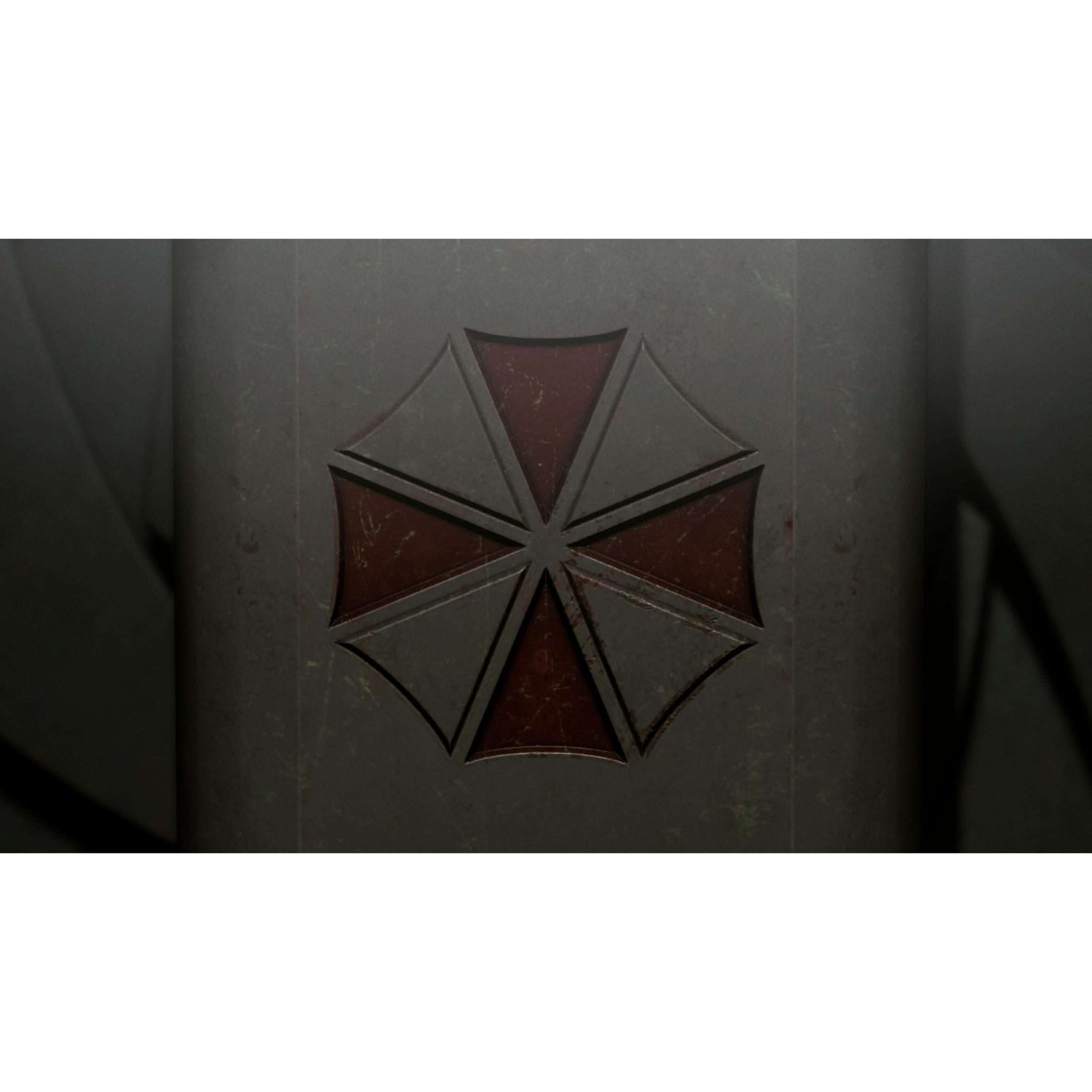 Un emblema grigio con segmenti rossi su una superficie scura.