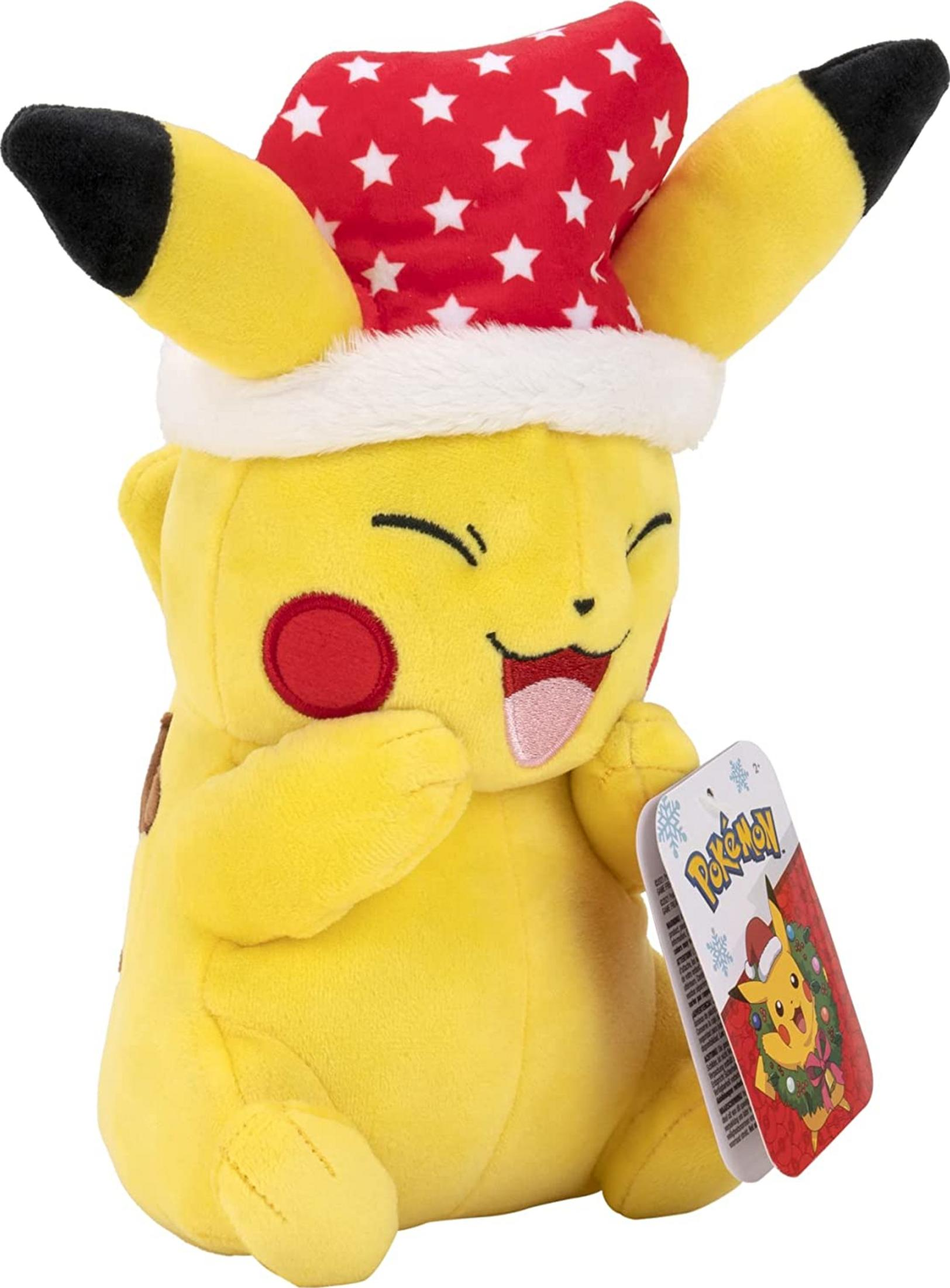 Ein gelber Pikachu-Plüsch mit Weihnachtsmütze und Anhänger.