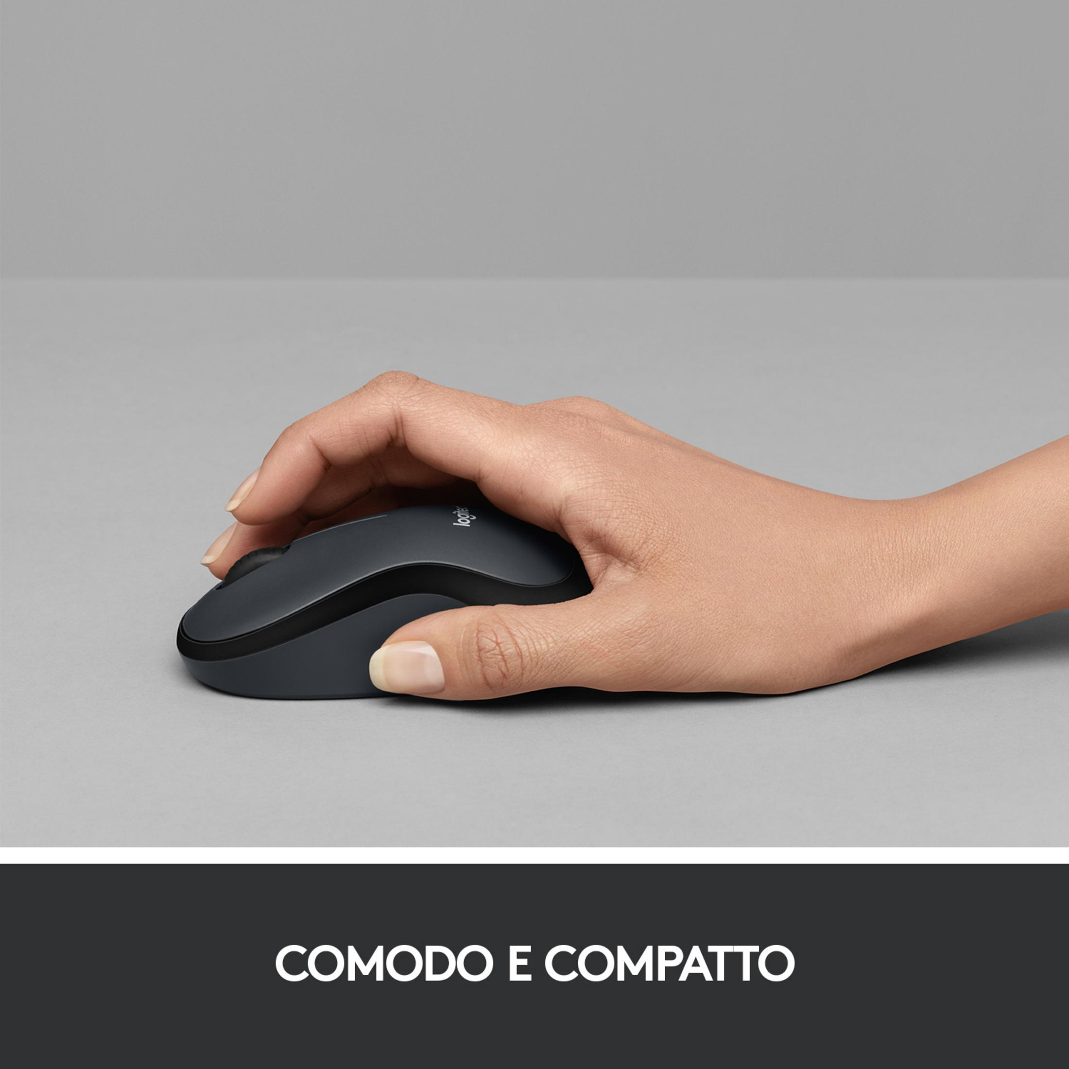 A hand operates a dark Logitech mouse on a gray surface.