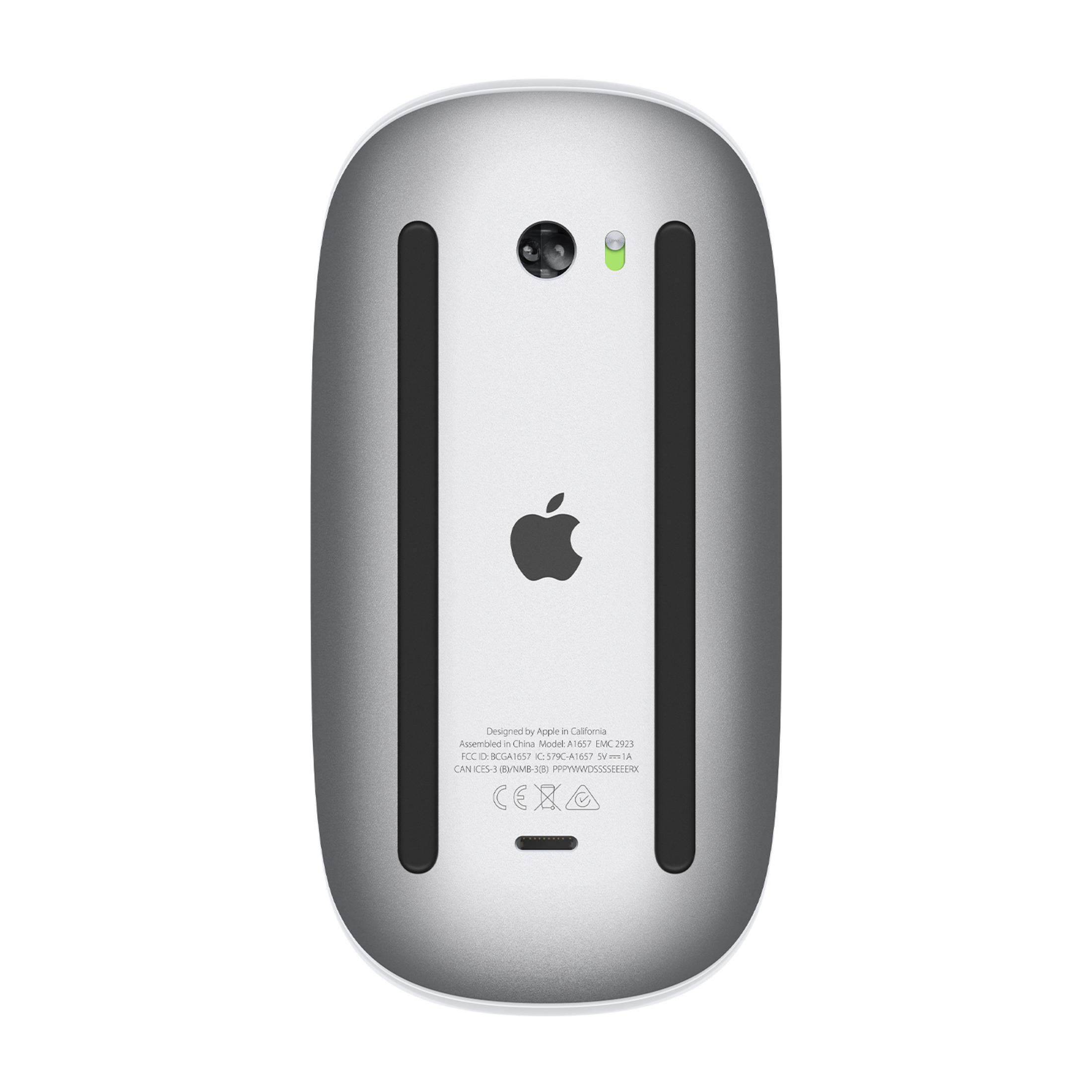 Spód Apple Magic Mouse z logo, czujnikami i napisami.