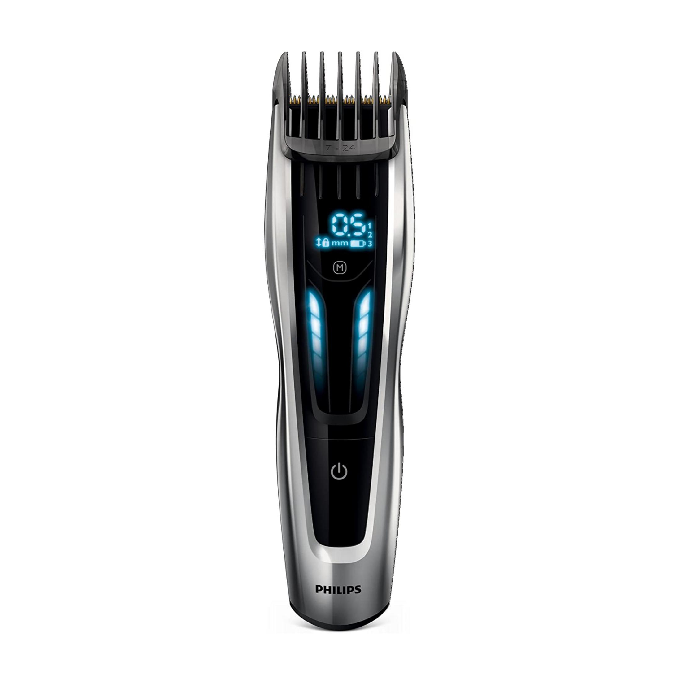 Una cortapelos Philips plateada con pantalla digital y luces azules.
