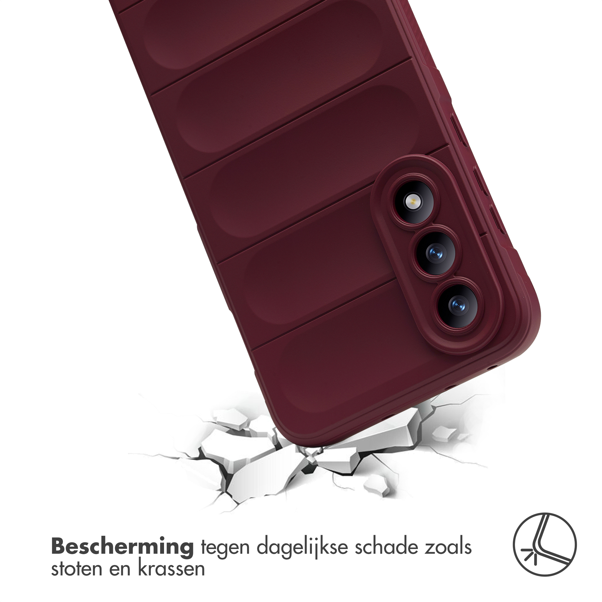 Een bordeauxrode telefoonhoes valt op gebarsten ondergrond.