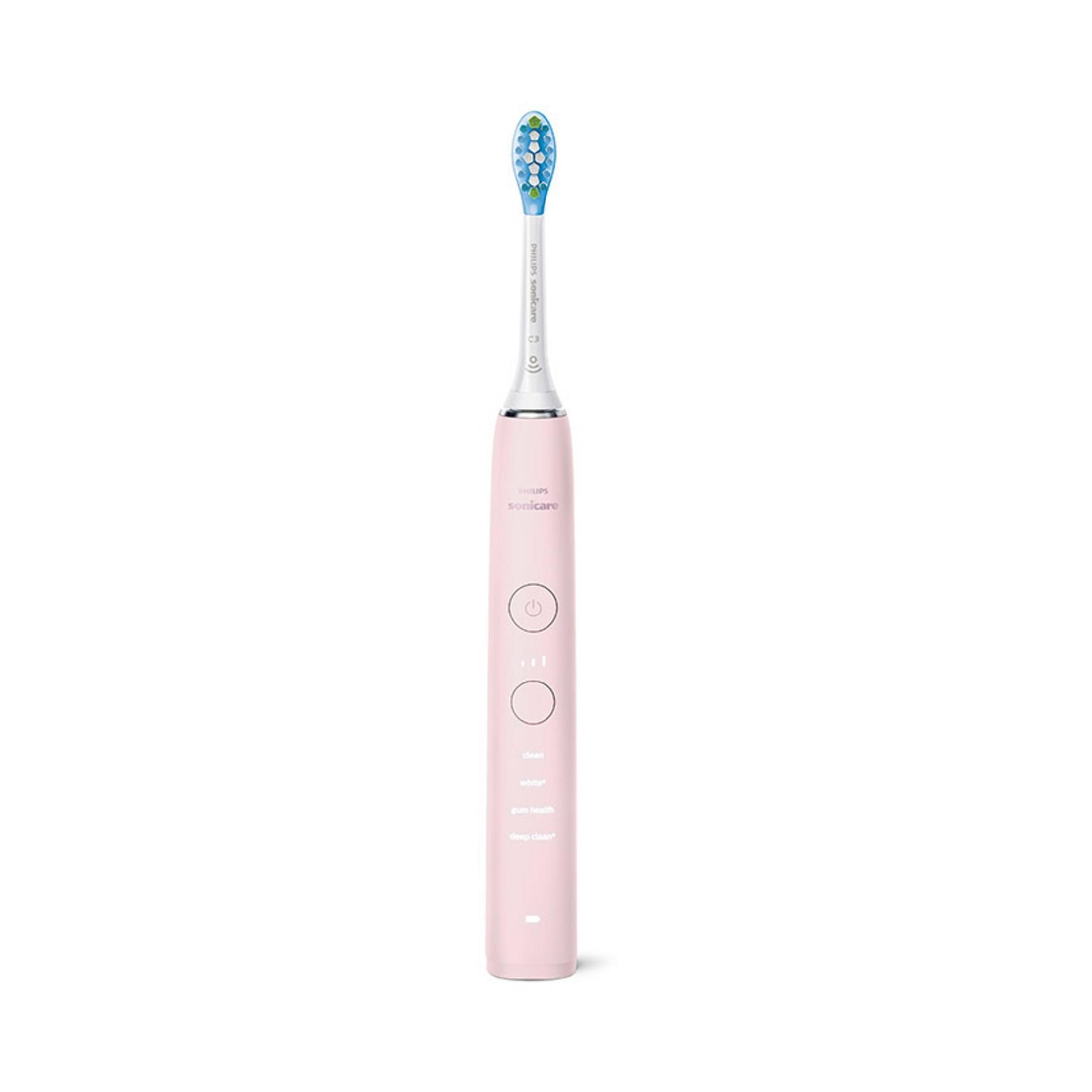 Un cepillo de dientes eléctrico rosa con mango blanco y cabezal azul.