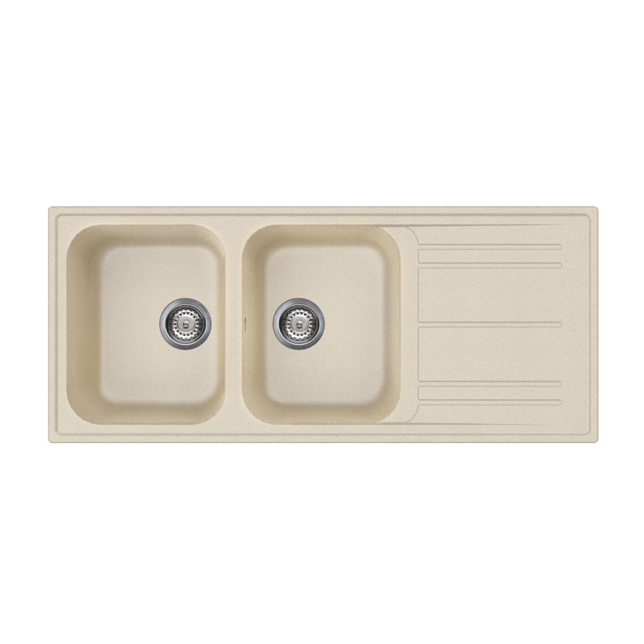 Un lavello beige a due vasche con un piano di scarico scanalato.