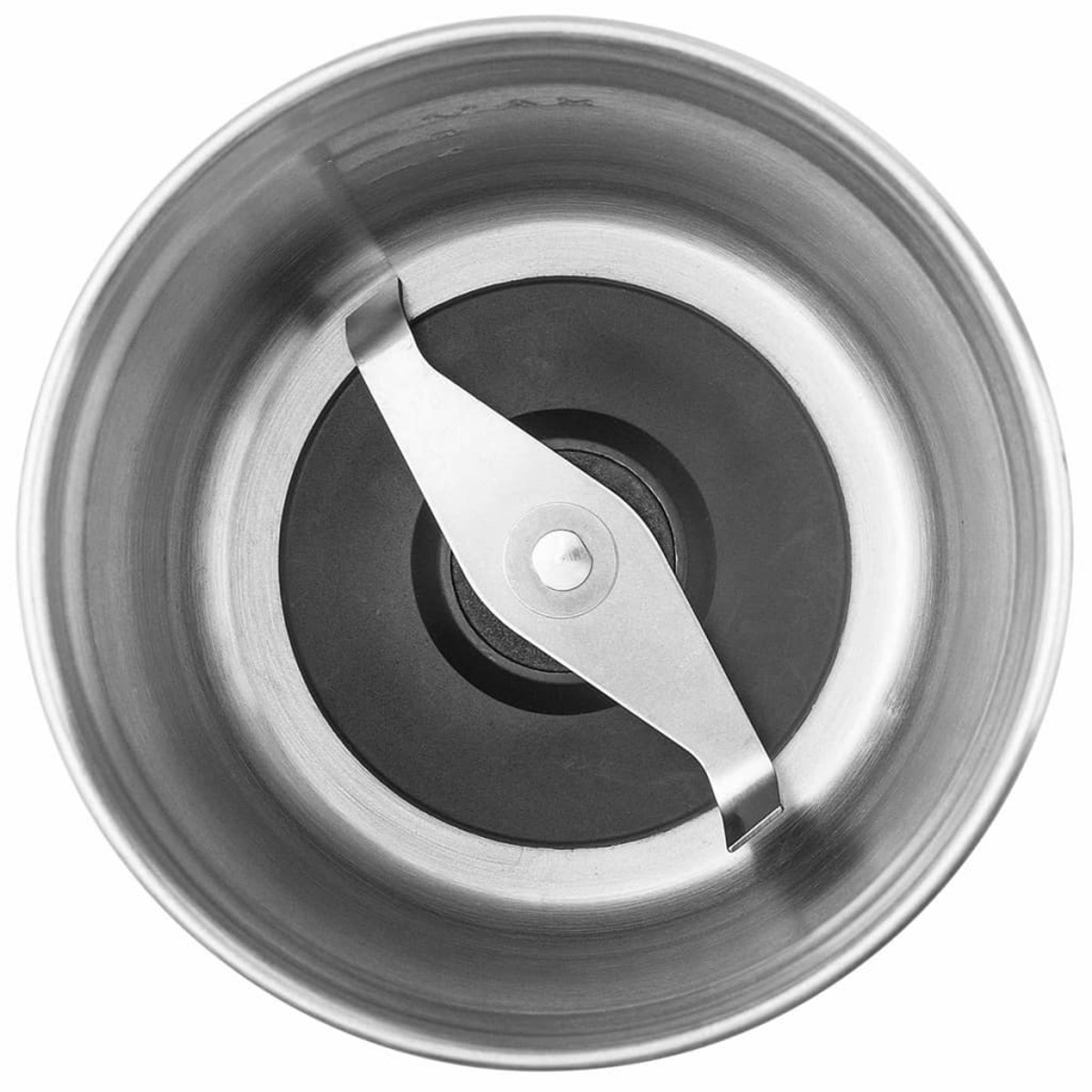 Close up of a metal grinder base with a black pad and a sharp blade.