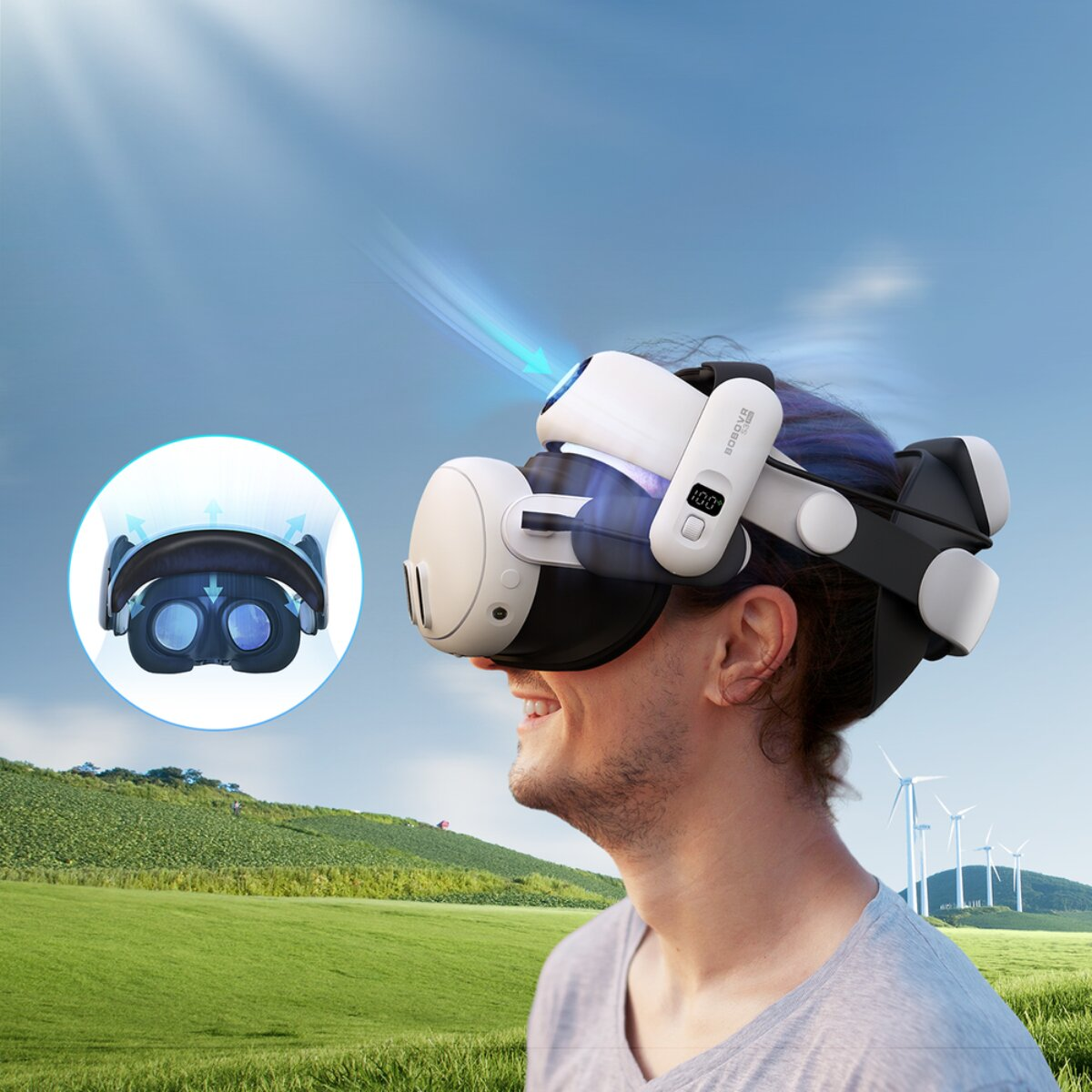 Uomo con visore VR, turbine eoliche e colline verdi sullo sfondo.