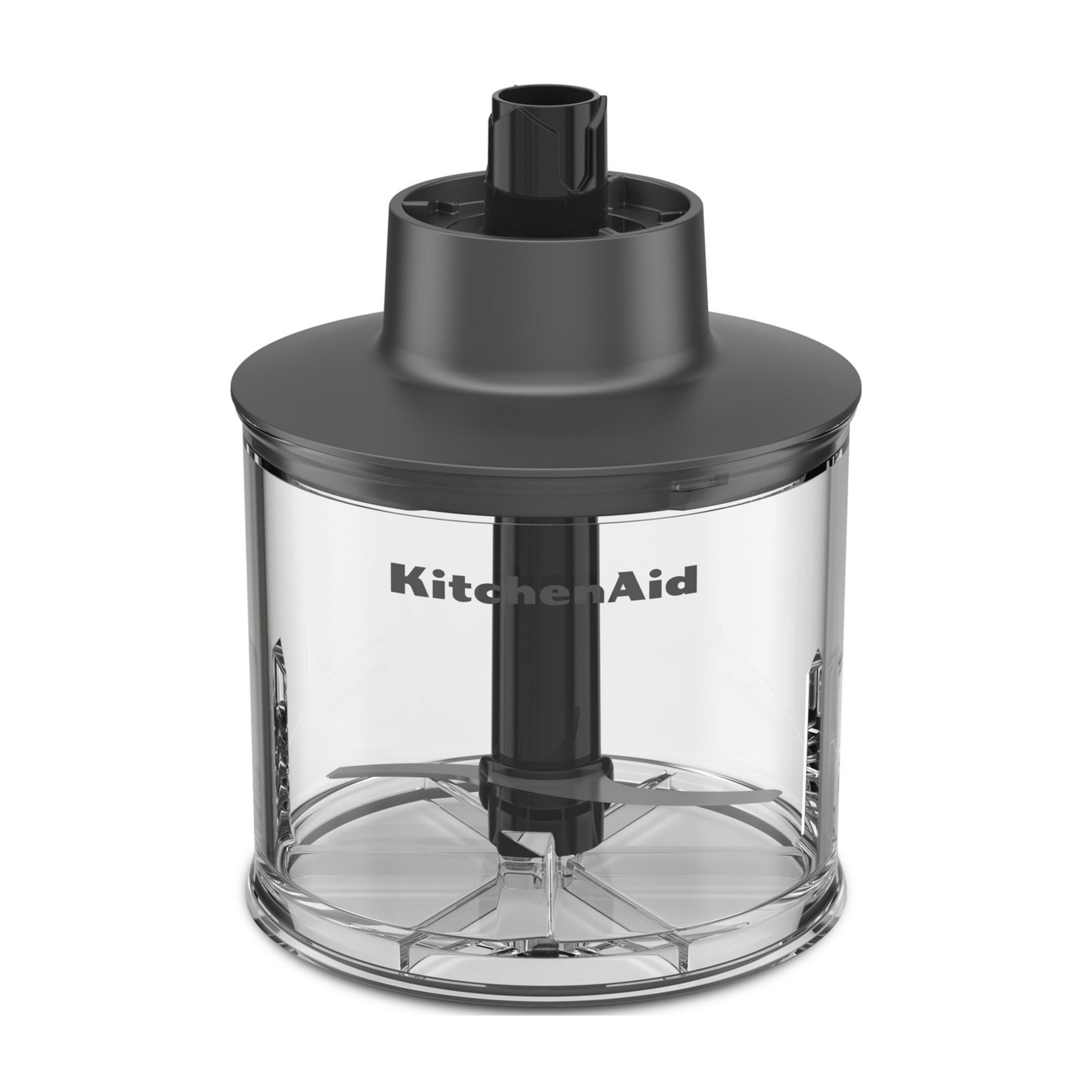 Przezroczysty pojemnik z logo KitchenAid i czarnymi ostrzami.