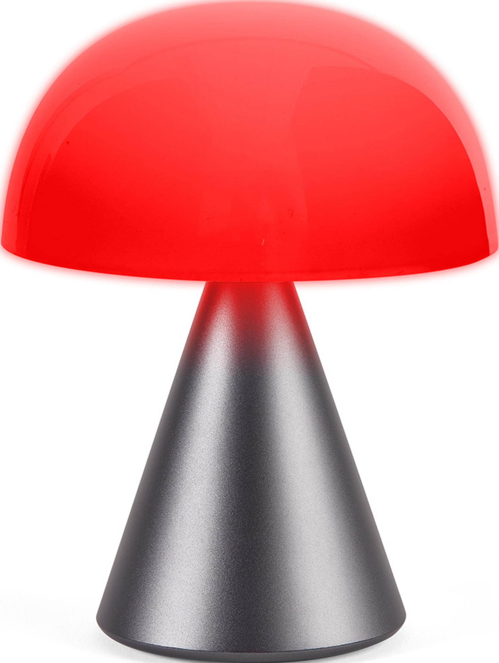 Una lámpara roja en forma de hongo con base cónica gris.