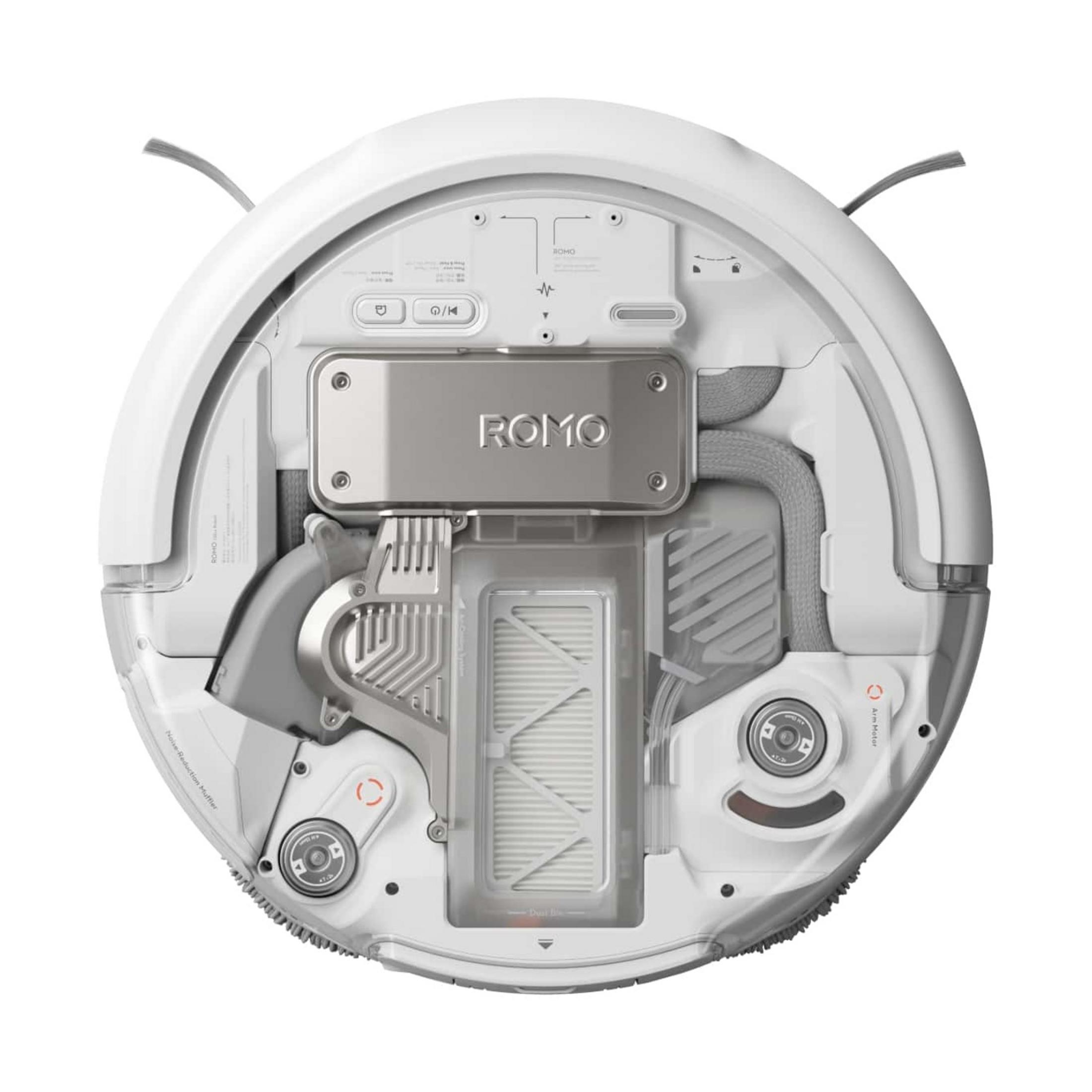 Spód białego robota odkurzającego z widocznymi elementami wewnętrznymi i szczotkami.