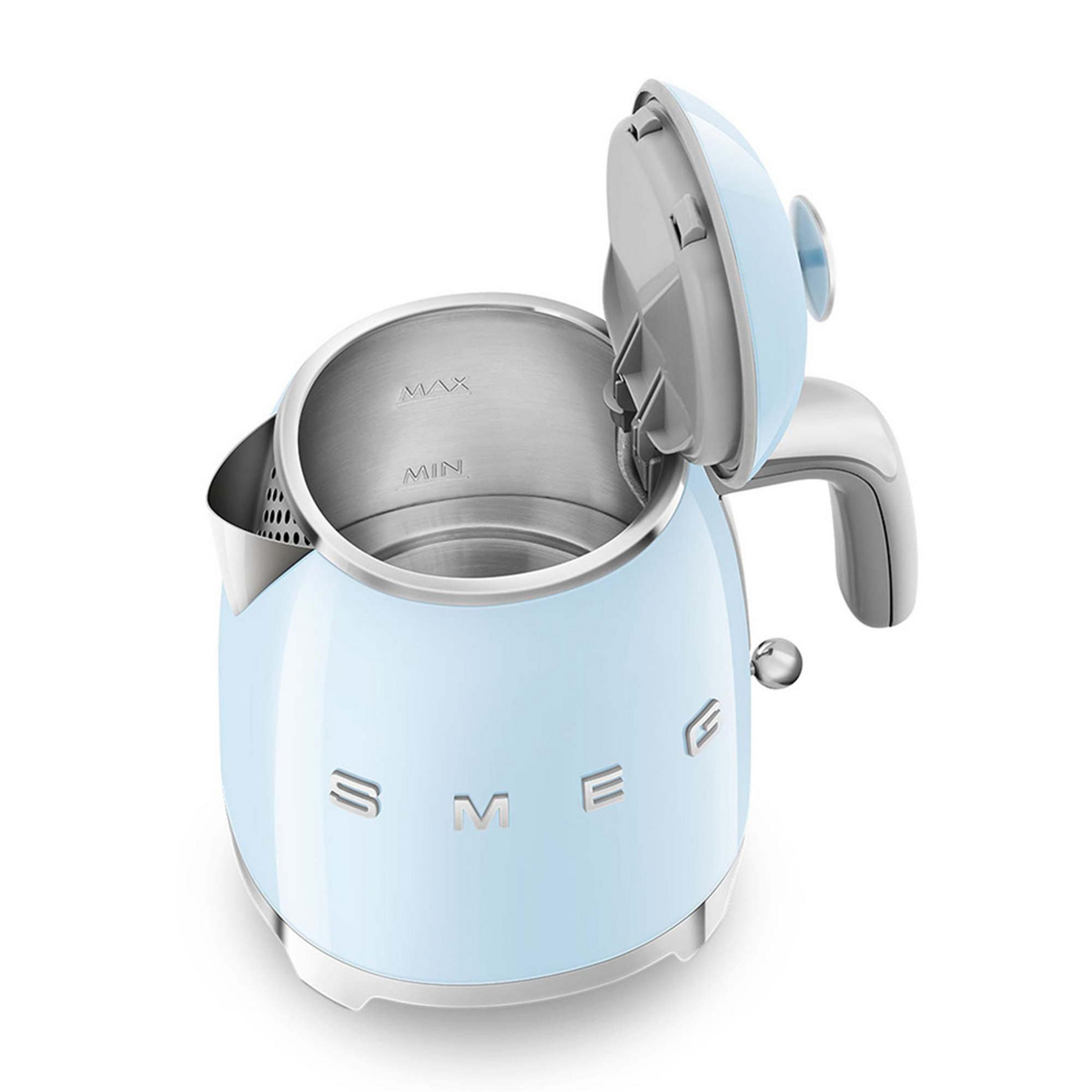 A light blue kettle with its lid open, showing the interior with water level markers.