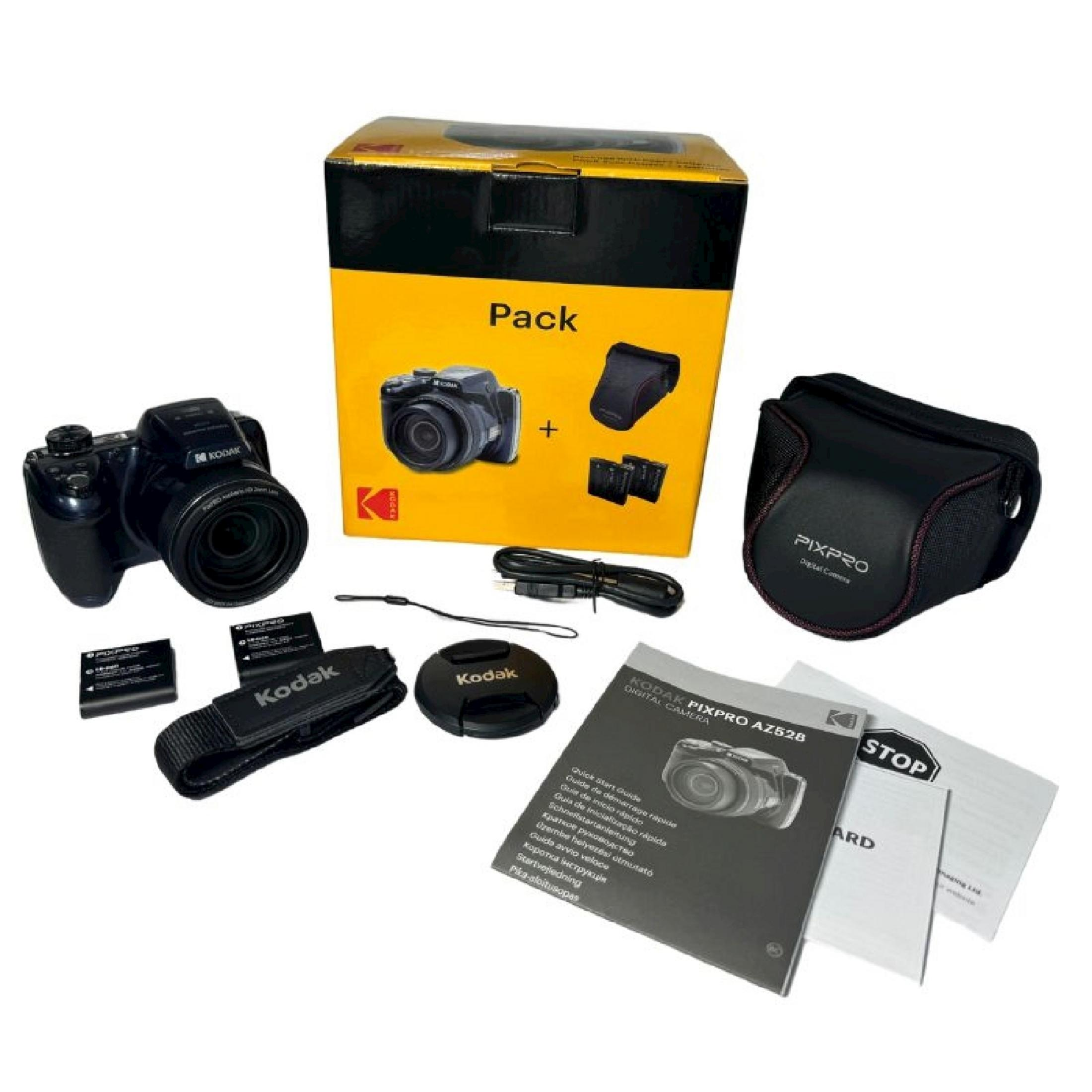Fotocamera digitale Kodak con accessori, cavi e manuale.