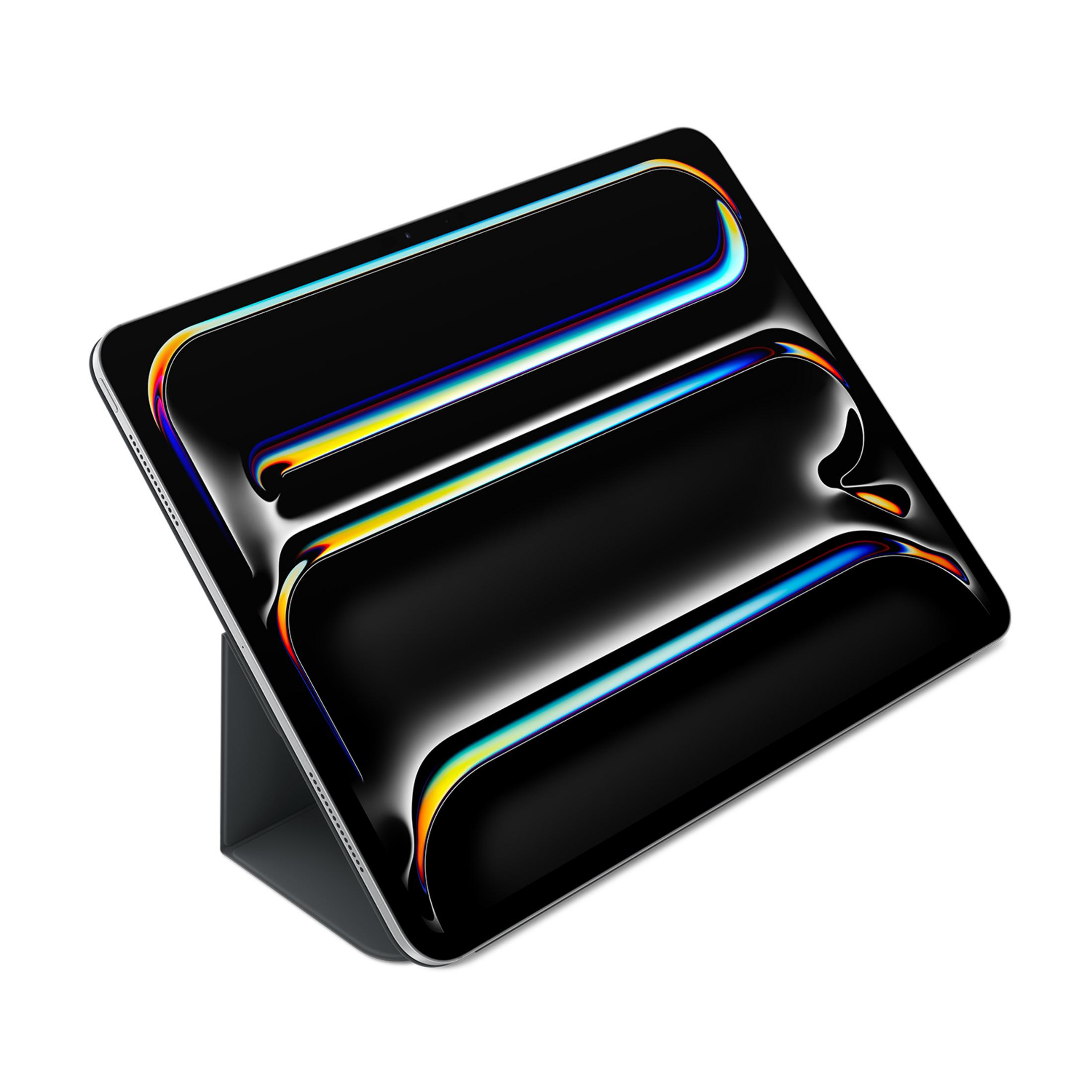 Szary tablet z czarną okładką, wyświetlający kolorowe, abstrakcyjne tło na ekranie.