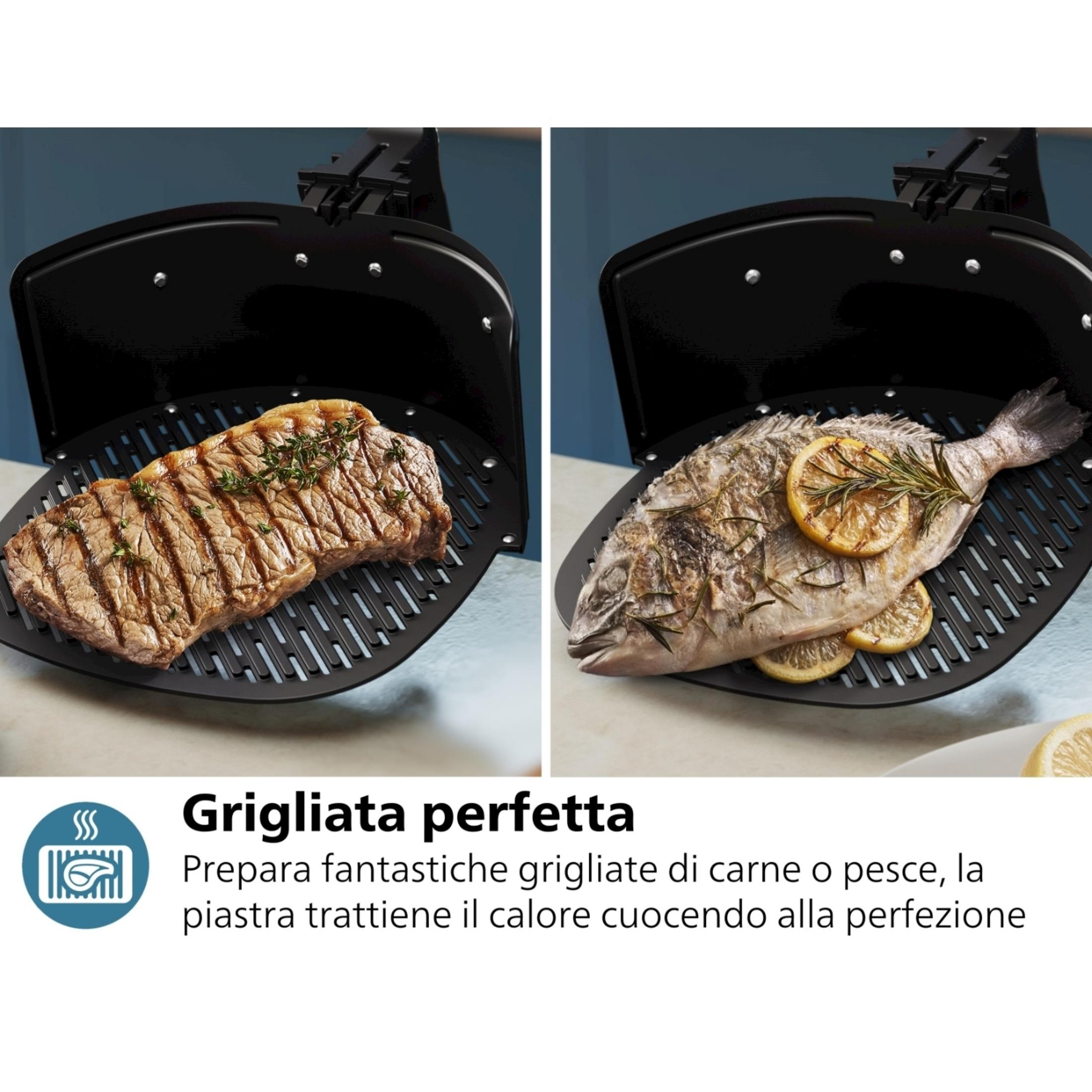 Ein Steak und ein ganzer Fisch mit Zitronen auf einem Grill.