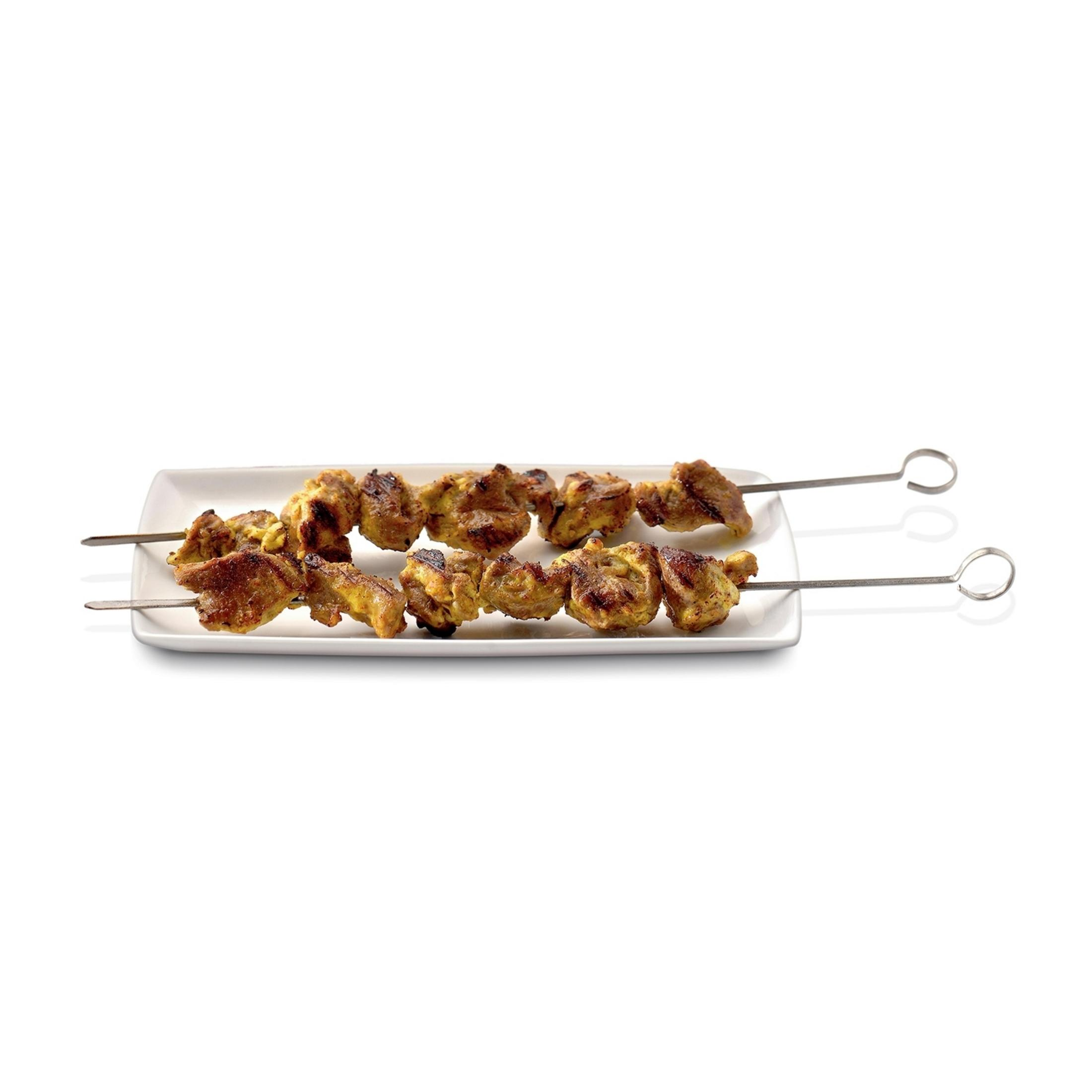 Two skewers of meat on a white plate, with pieces of cooked meat.