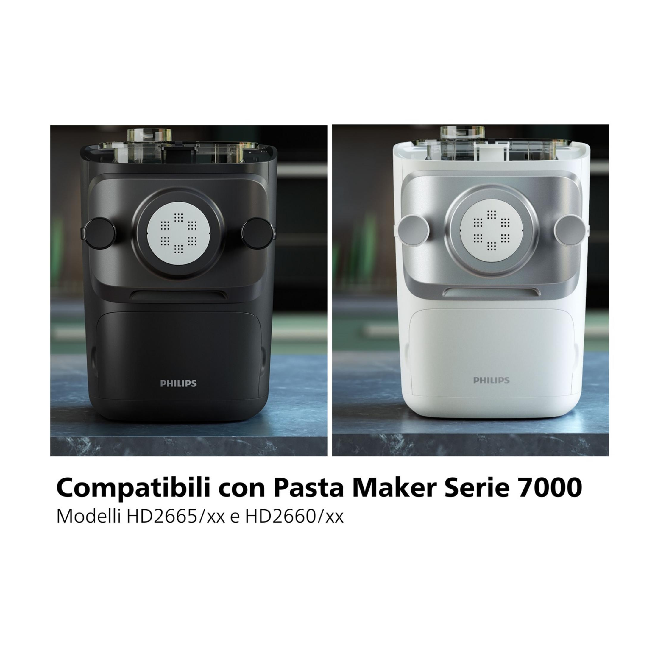 Two Philips Pasta Makers, one black, one white, on a marble surface.