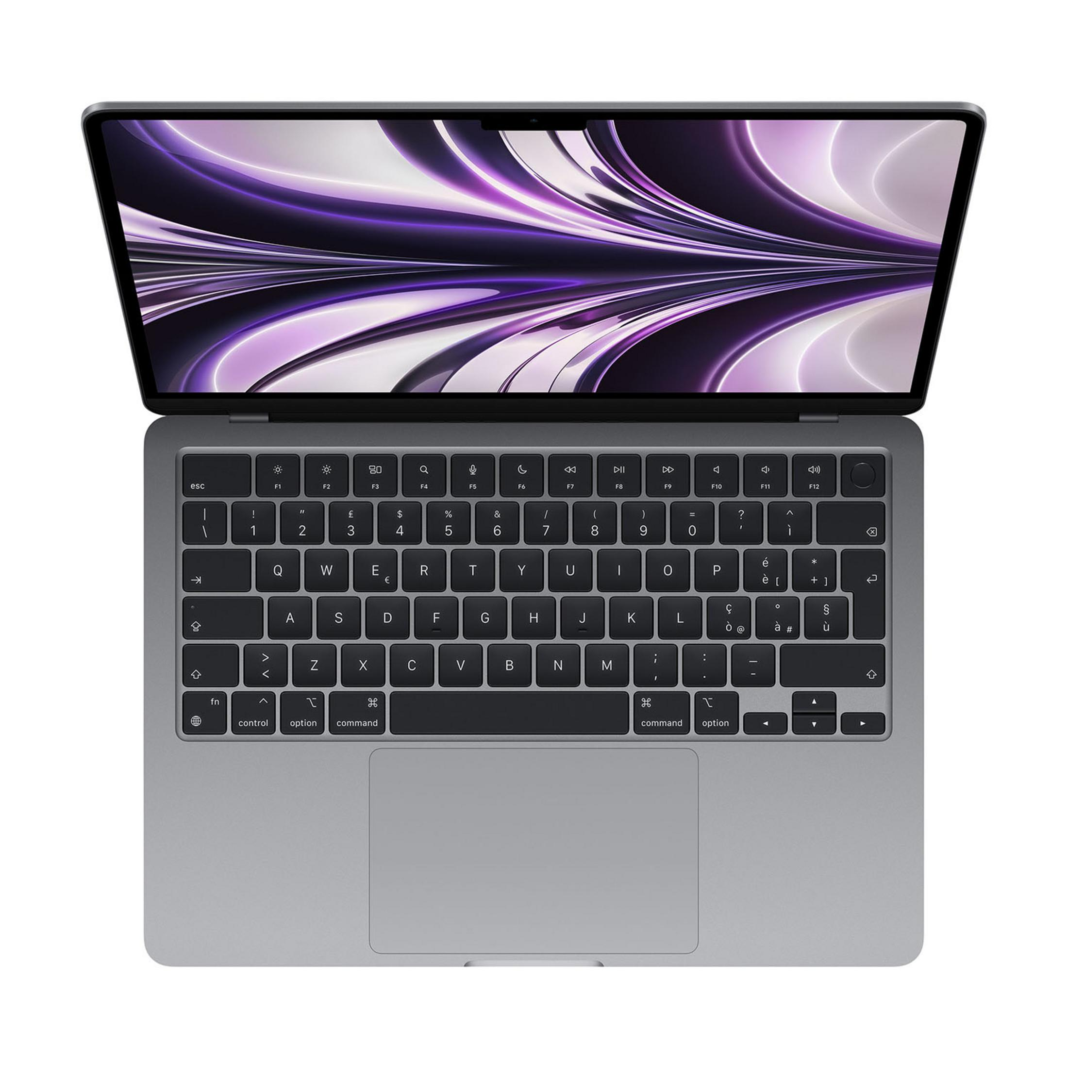 Un MacBook grigio con lo schermo aperto, che mostra uno sfondo viola.