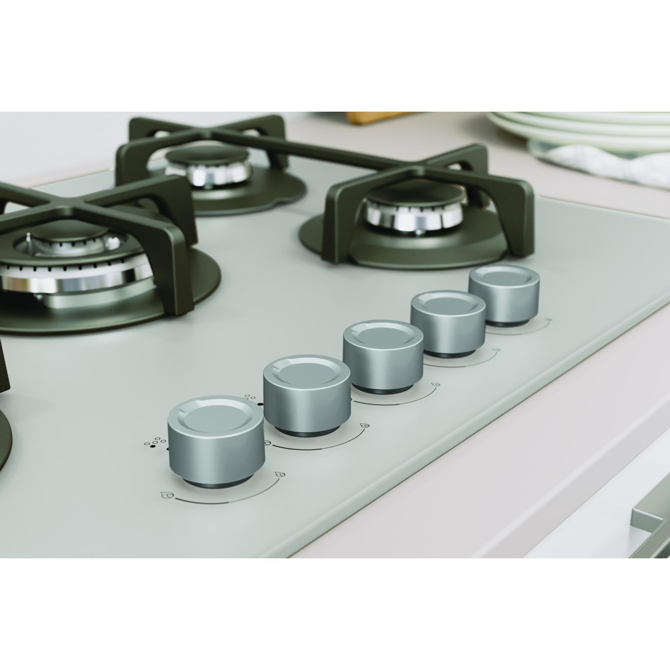 Nowoczesna kuchenka gazowa z czterema palnikami i srebrnymi pokrętłami.