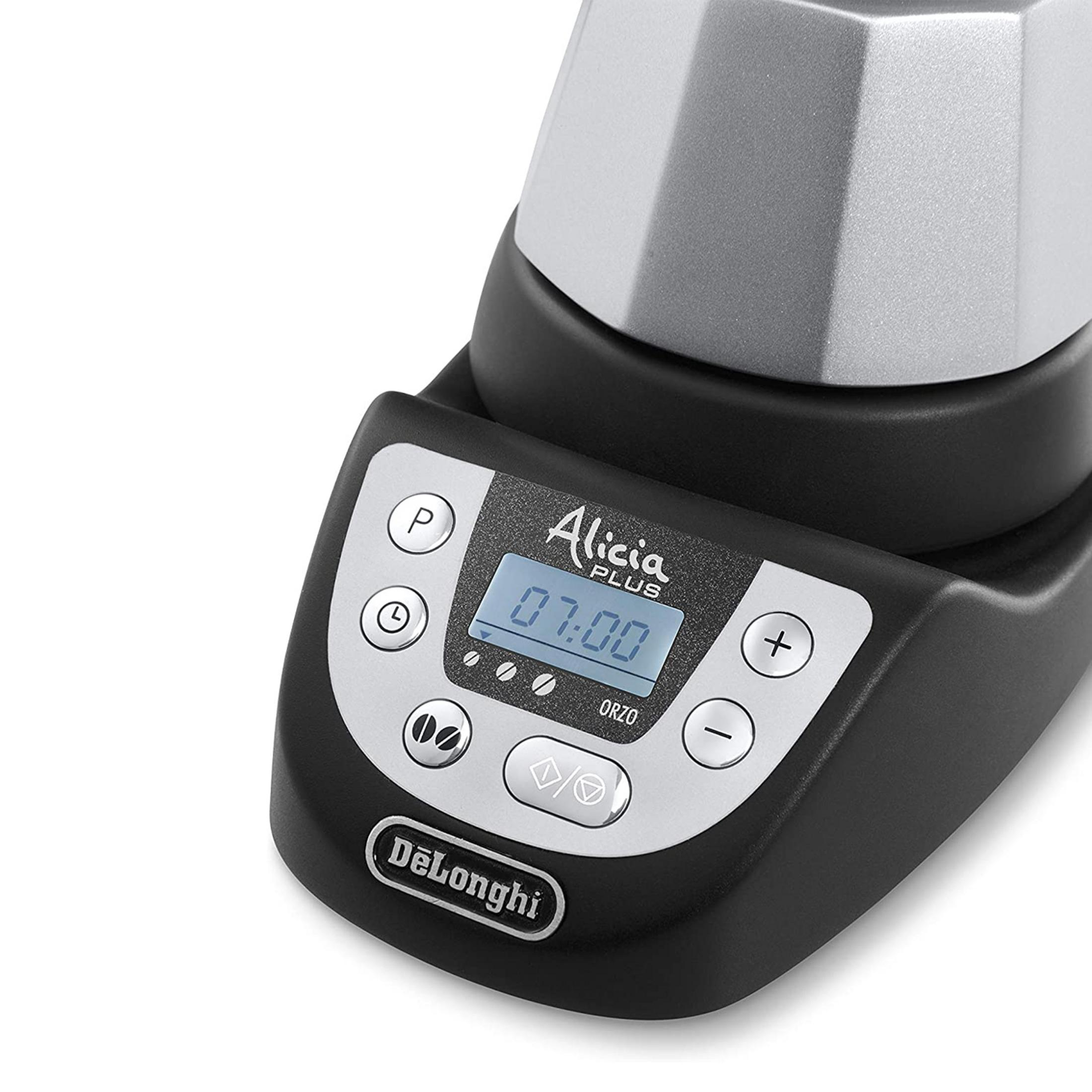 Nahaufnahme einer schwarzen Kaffeemaschine mit silbernem Deckel und digitaler Anzeige.