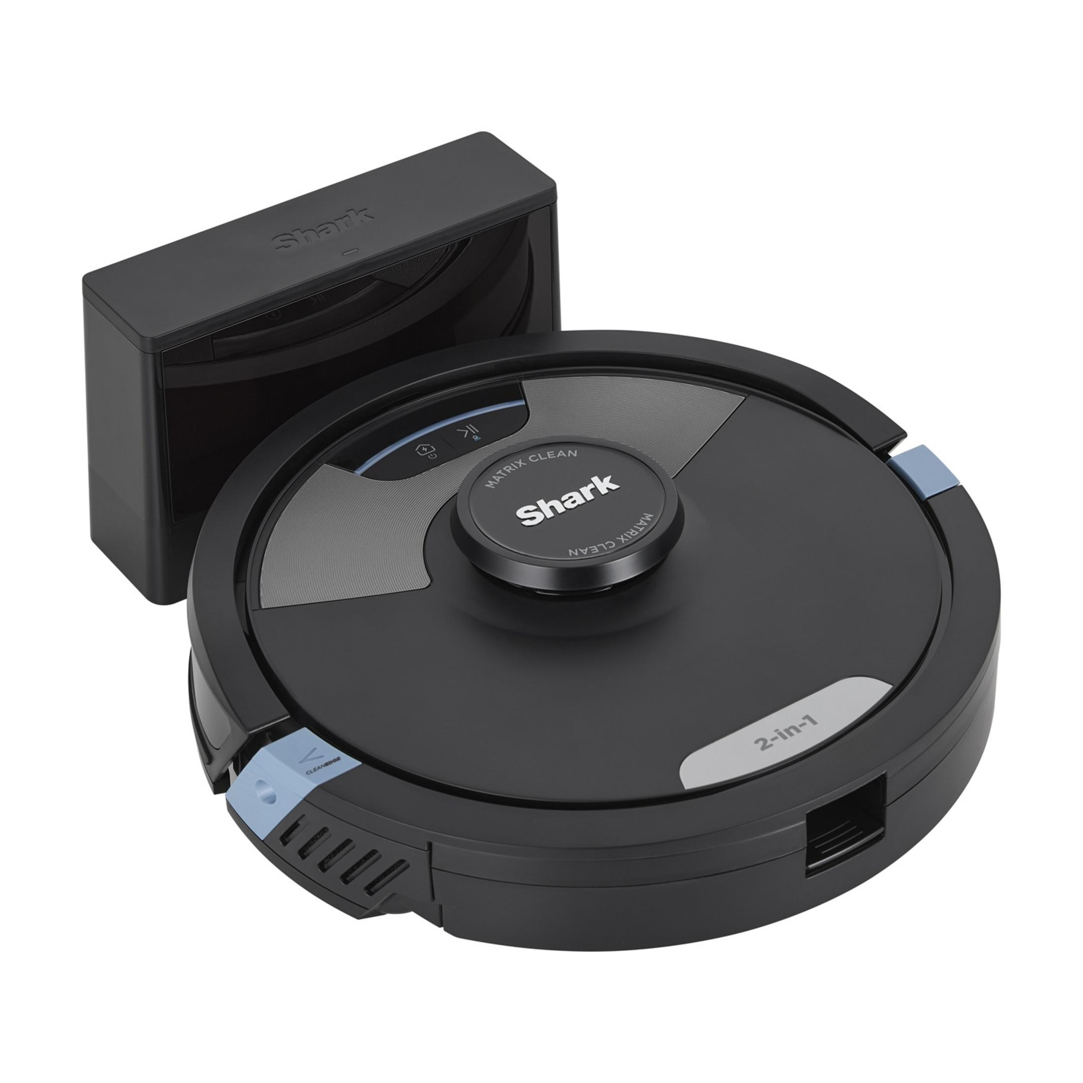 A black Shark robot vacuum cleaner with its charging dock. It is round with a logo.