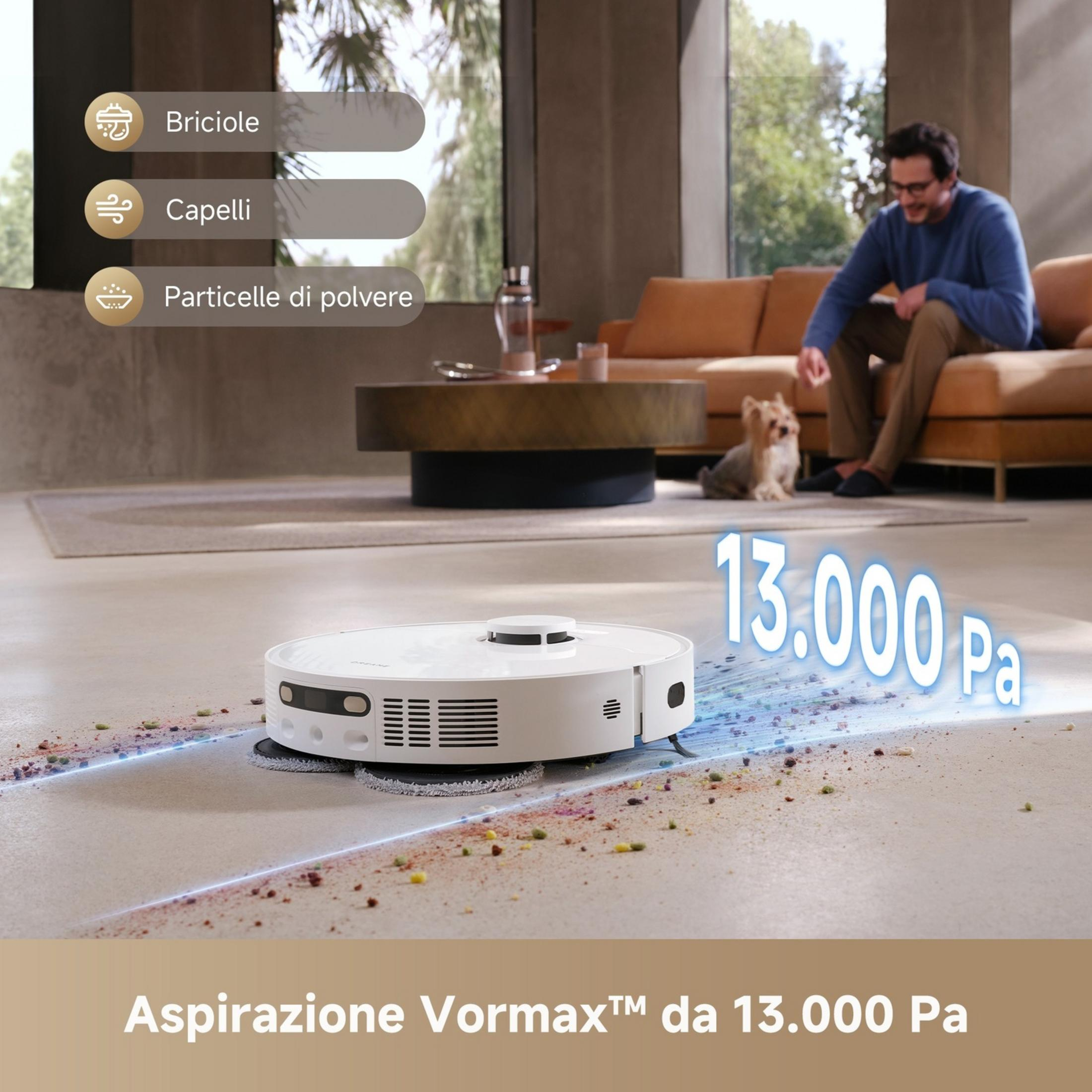 Un robot aspirapolvere bianco pulisce briciole, capelli e polvere.
