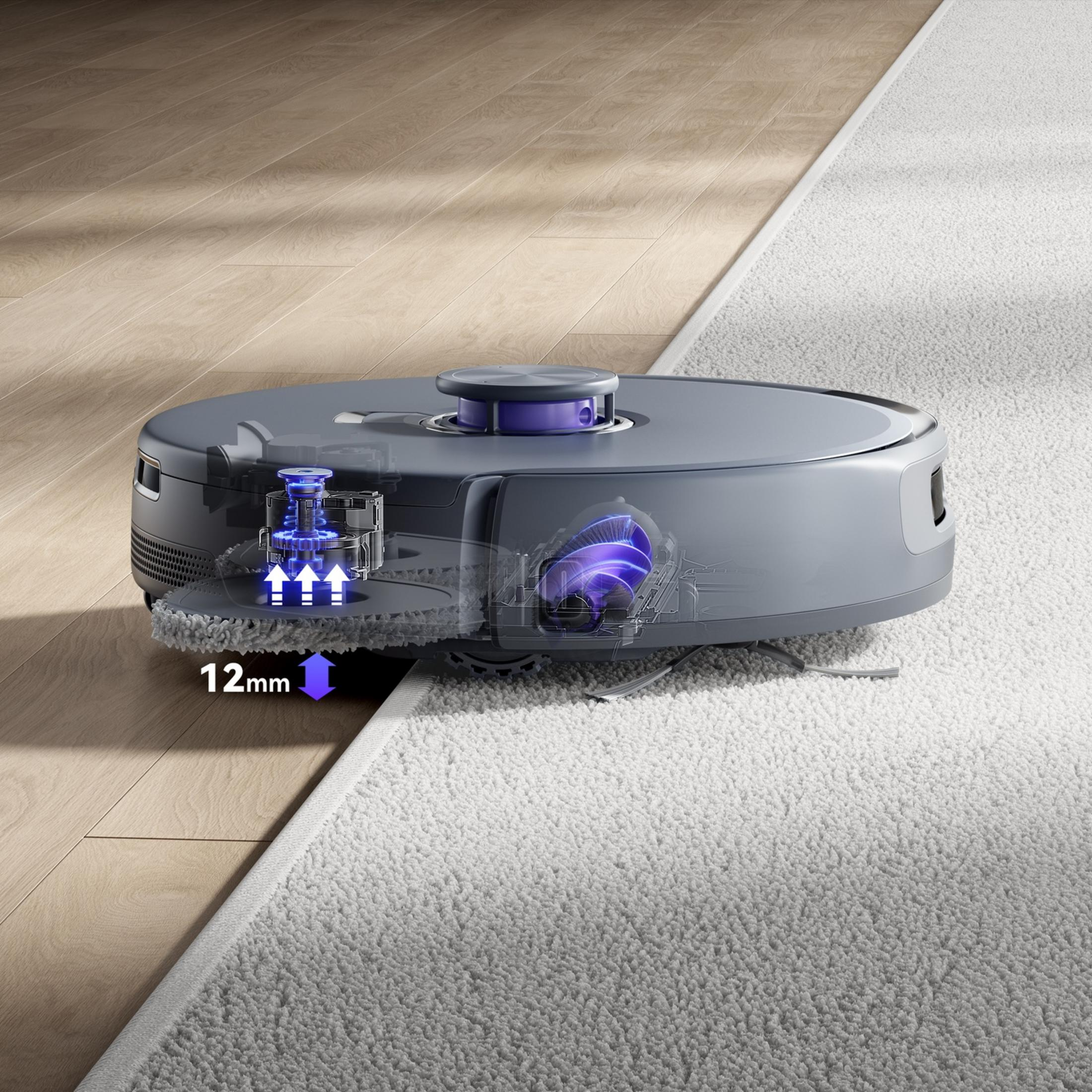 Szary robot sprzątający na drewnie i dywanie z różnicą 12mm.