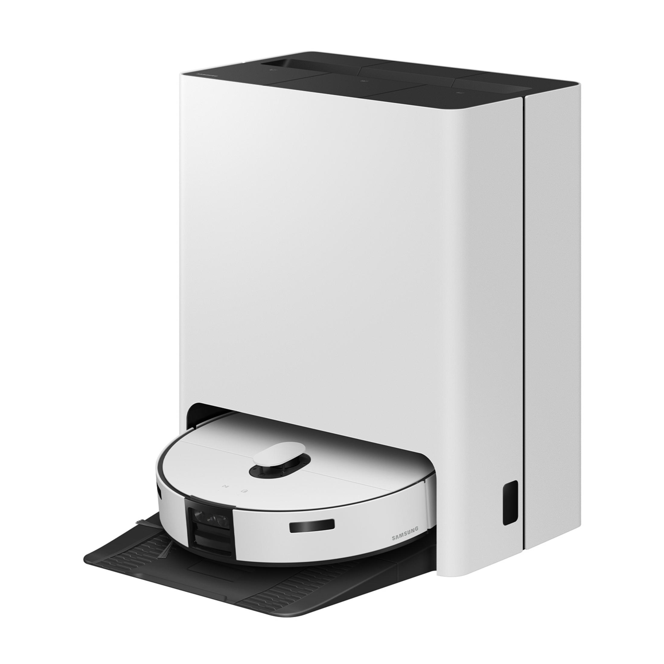 Biały robot sprzątający znajduje się na czarnej stacji ładującej.