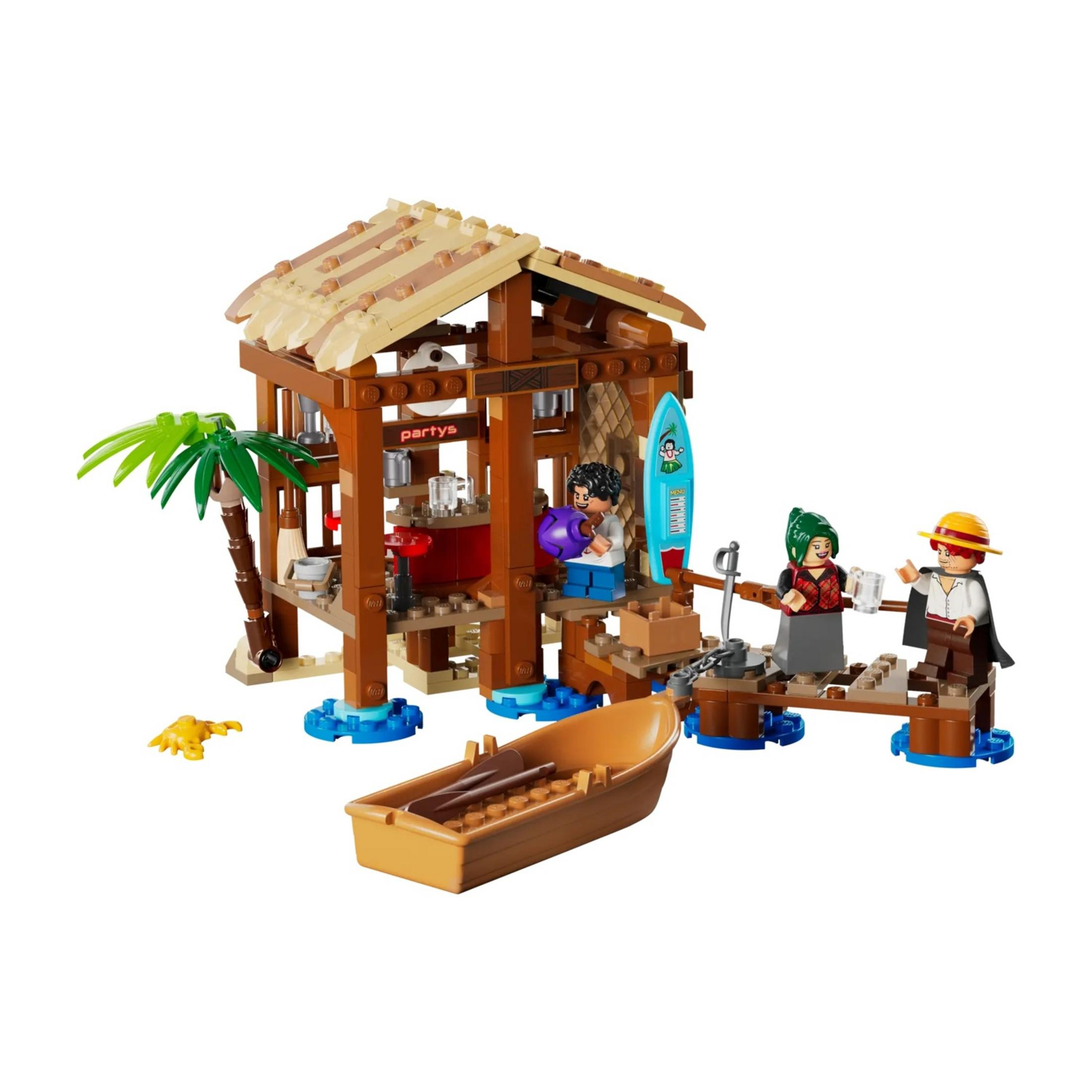 Una capanna da spiaggia Lego con palme, barca, surfisti e un granchio giallo.